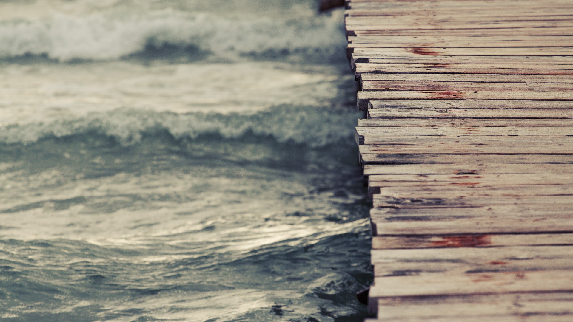 Wooden pier next to the sea with waves HD Wallpaper