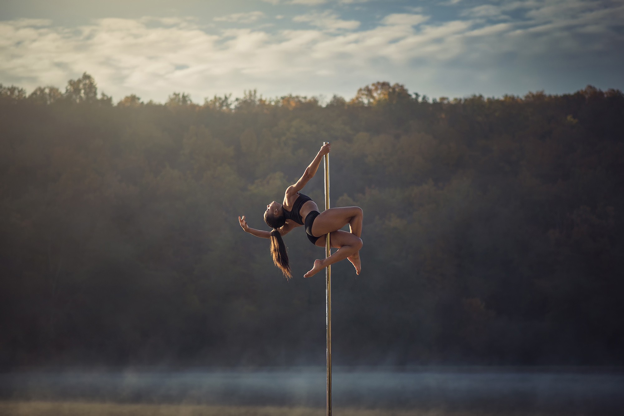 Woman performing pole dance on a misty lake HD Wallpaper