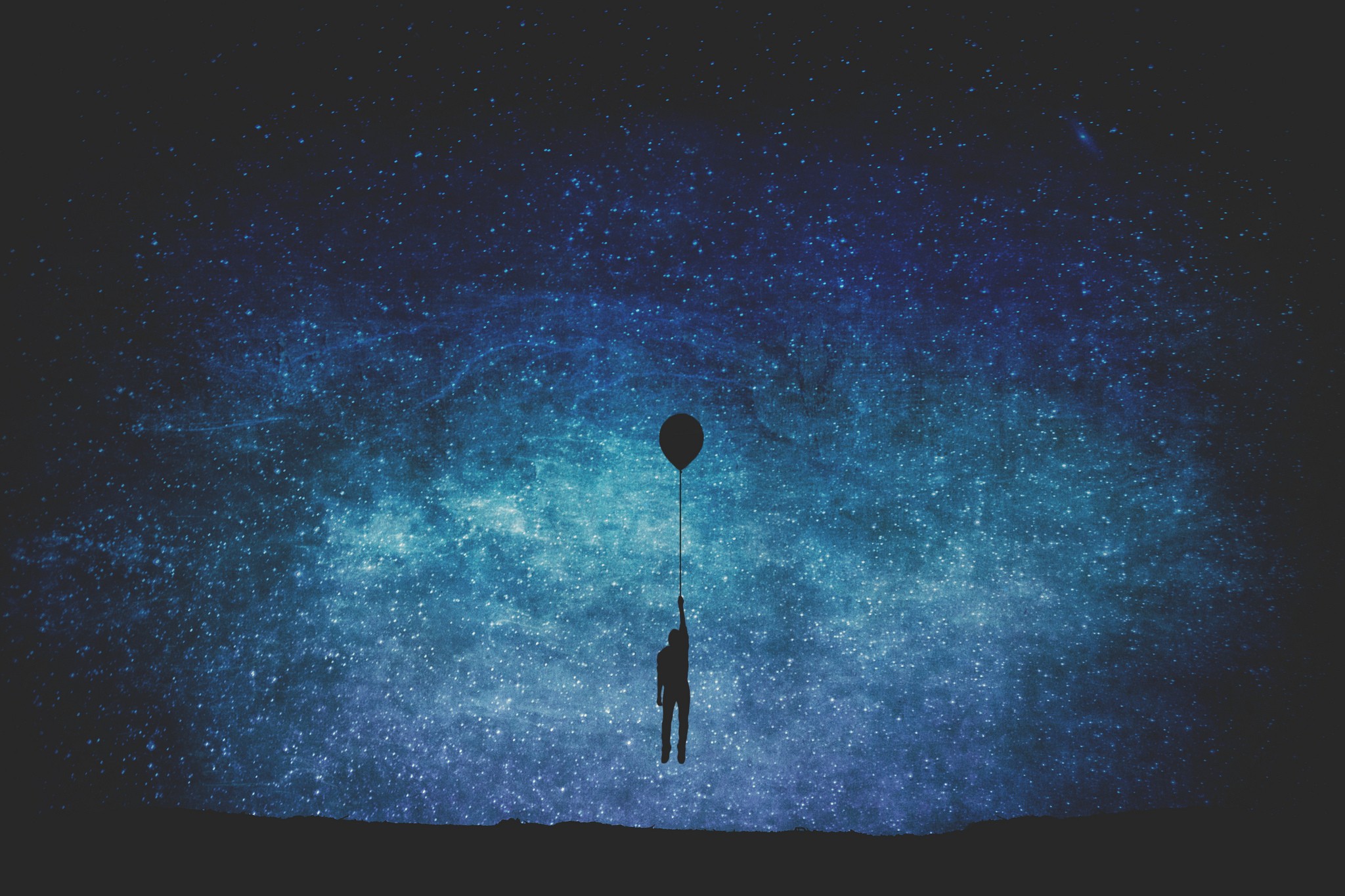 Silhouette of a person holding a balloon against a starry night sky HD Wallpaper