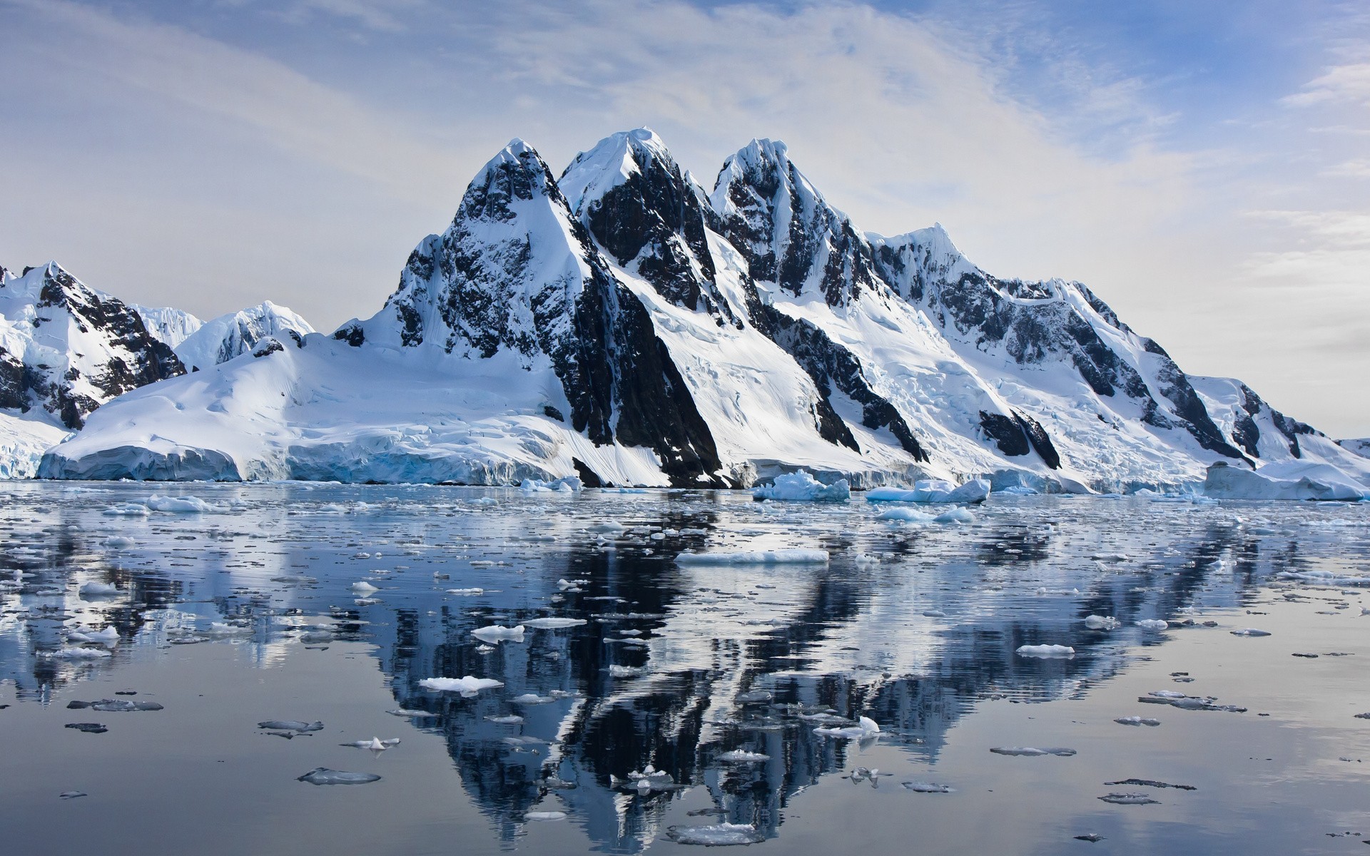 Snow-capped mountains reflected in the sea HD Wallpaper