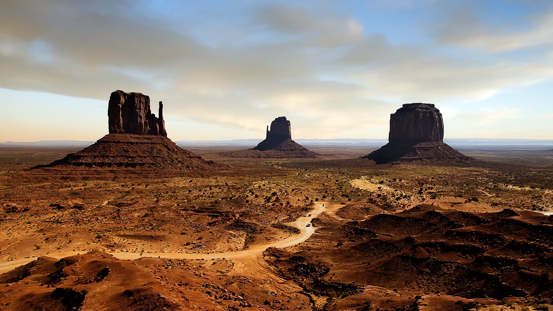 Monument Valley desert landscape with rock formations HD Wallpaper