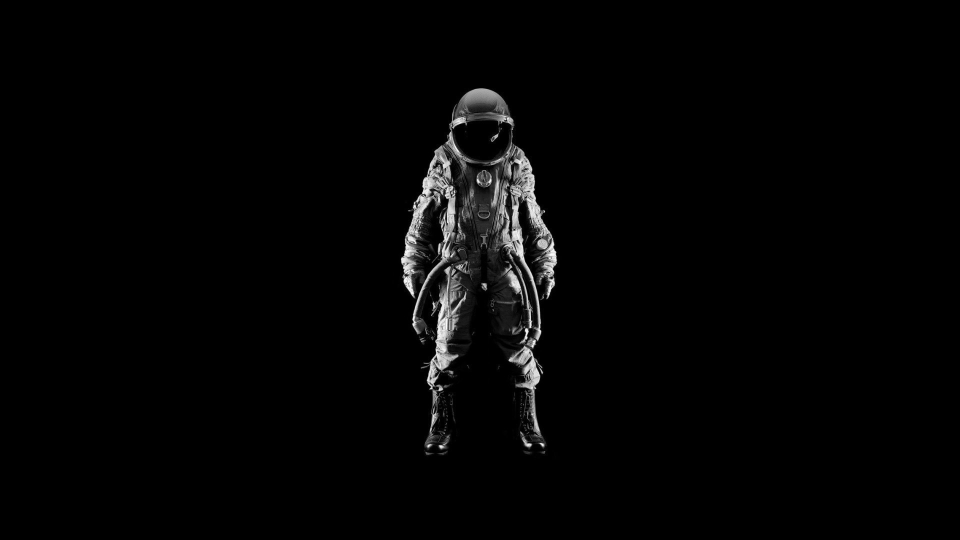 Astronaut in a spacesuit on a black background HD Wallpaper