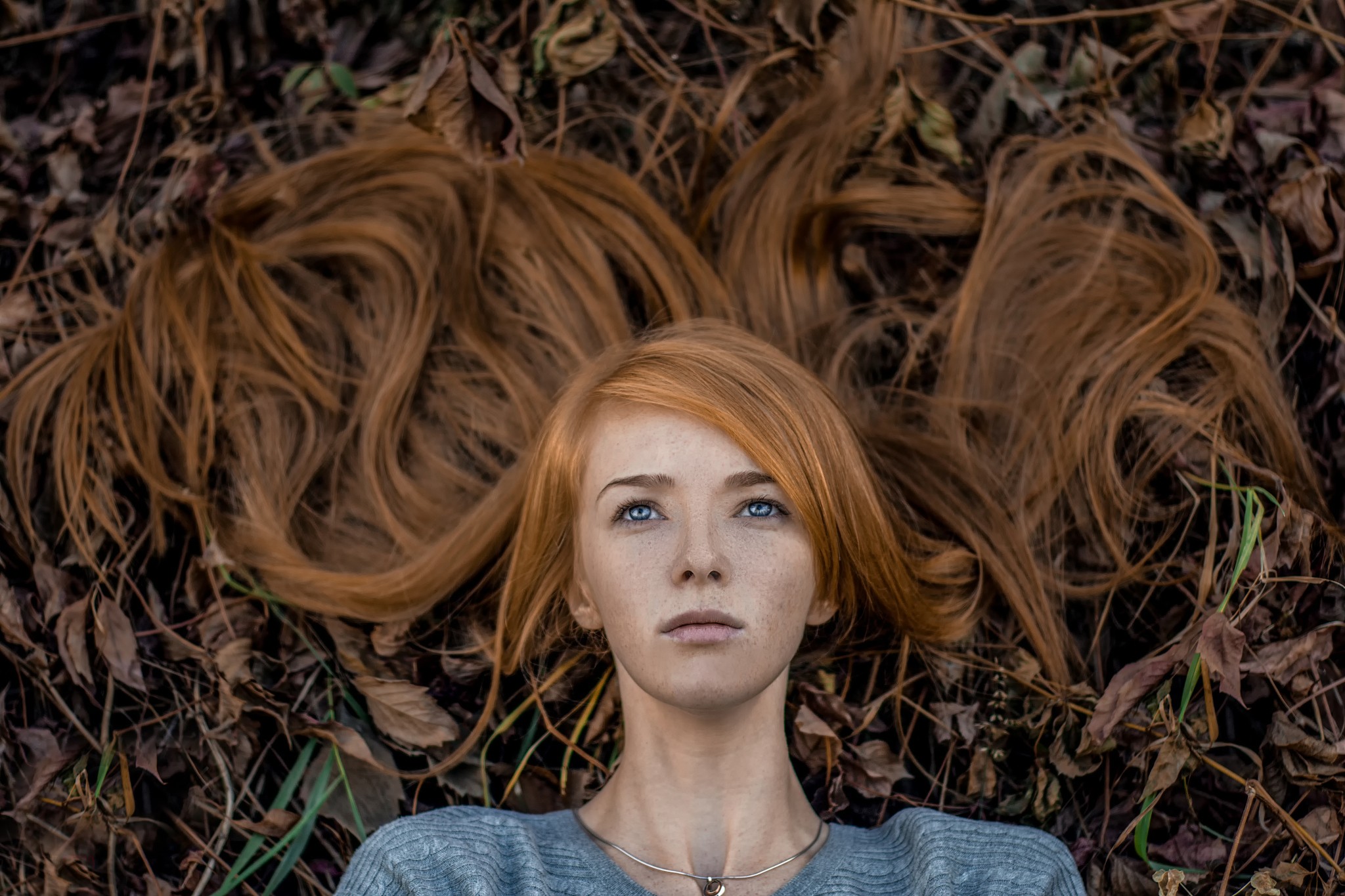 Woman with red hair lying on the ground HD Wallpaper