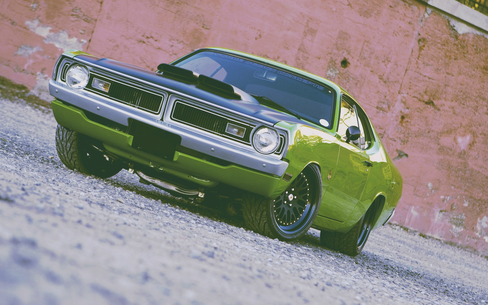 Green Dodge Challenger muscle car parked on gravel HD Wallpaper