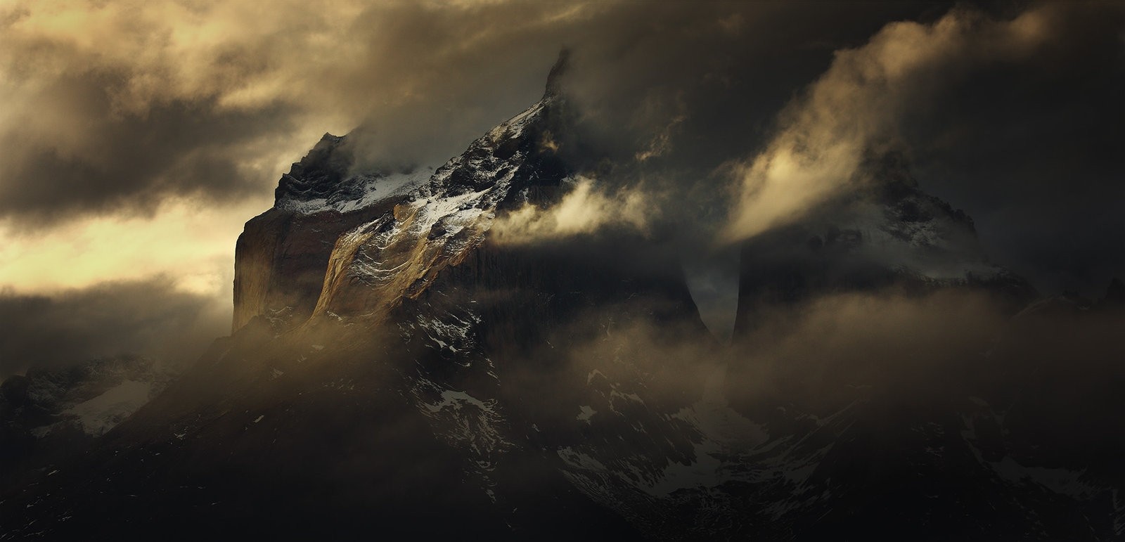 Torres del Paine mountains shrouded in clouds HD Wallpaper
