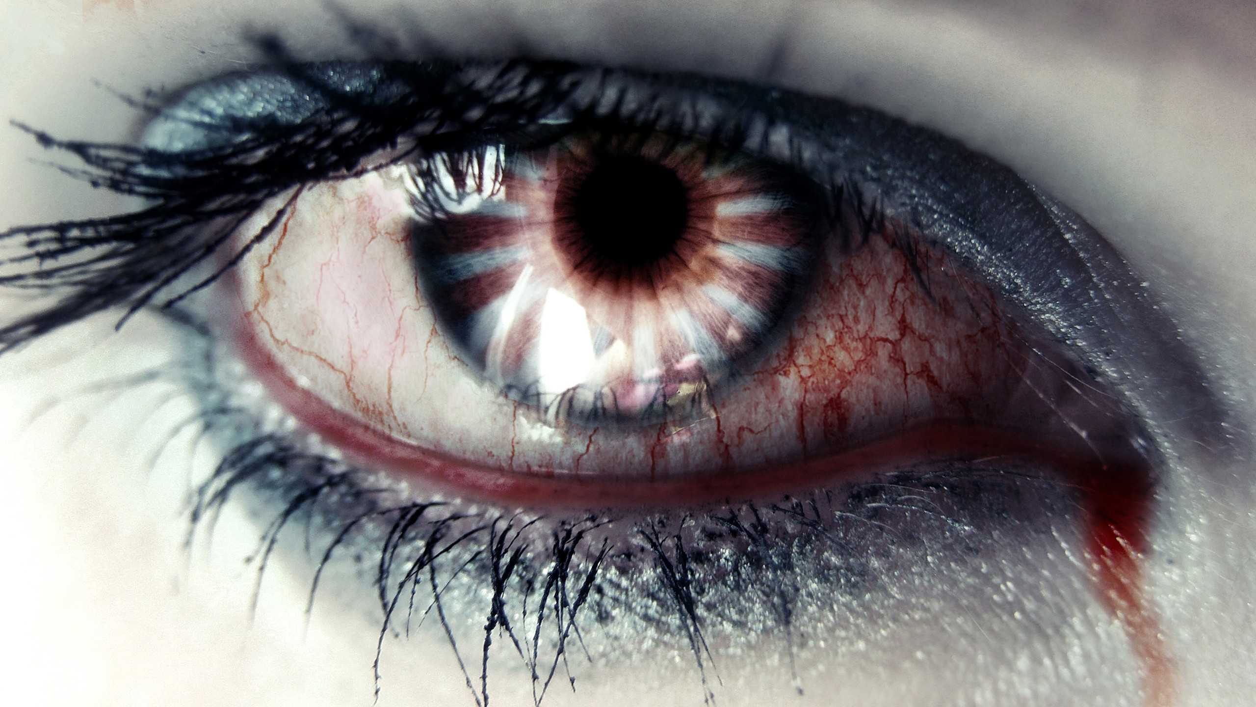 Close-up of a bloodshot eye with a reflection HD Wallpaper