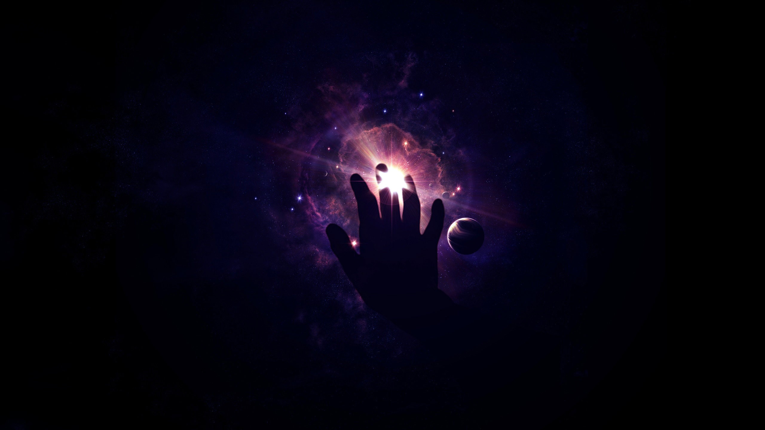 Silhouette of a hand reaching towards a bright nebula in space HD Wallpaper