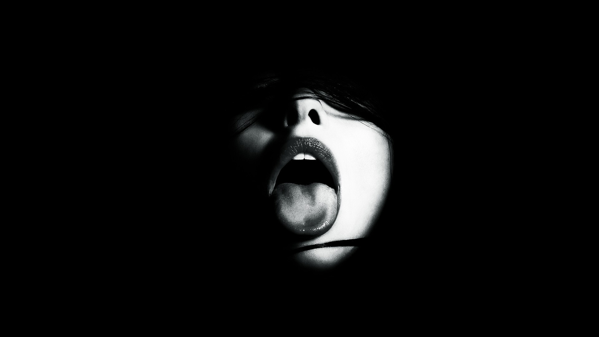 Woman with open mouth and tongue out in monochrome HD Wallpaper