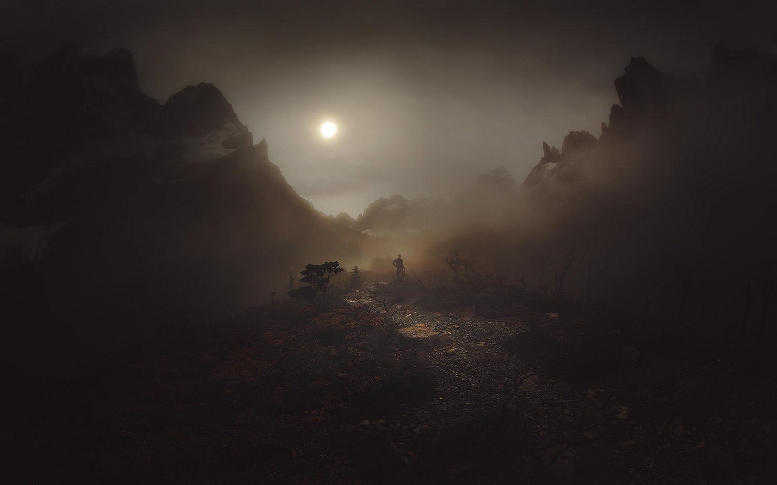 Man standing in misty mountains of Patagonia, Chile HD Wallpaper