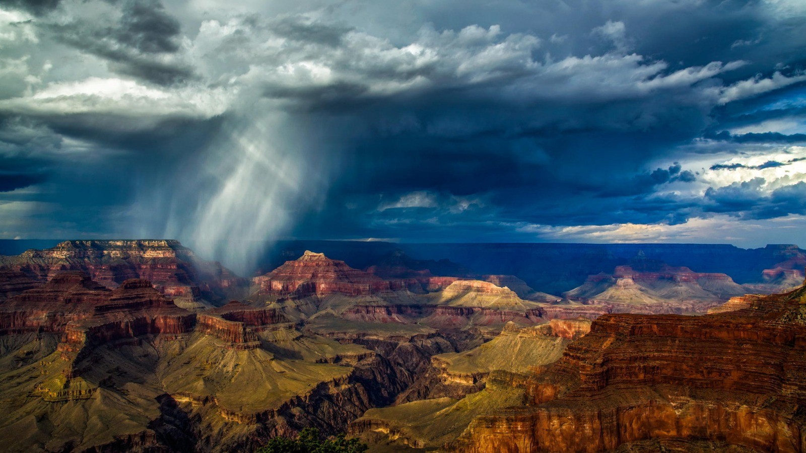 Grand Canyon with dramatic storm clouds and rain HD Wallpaper