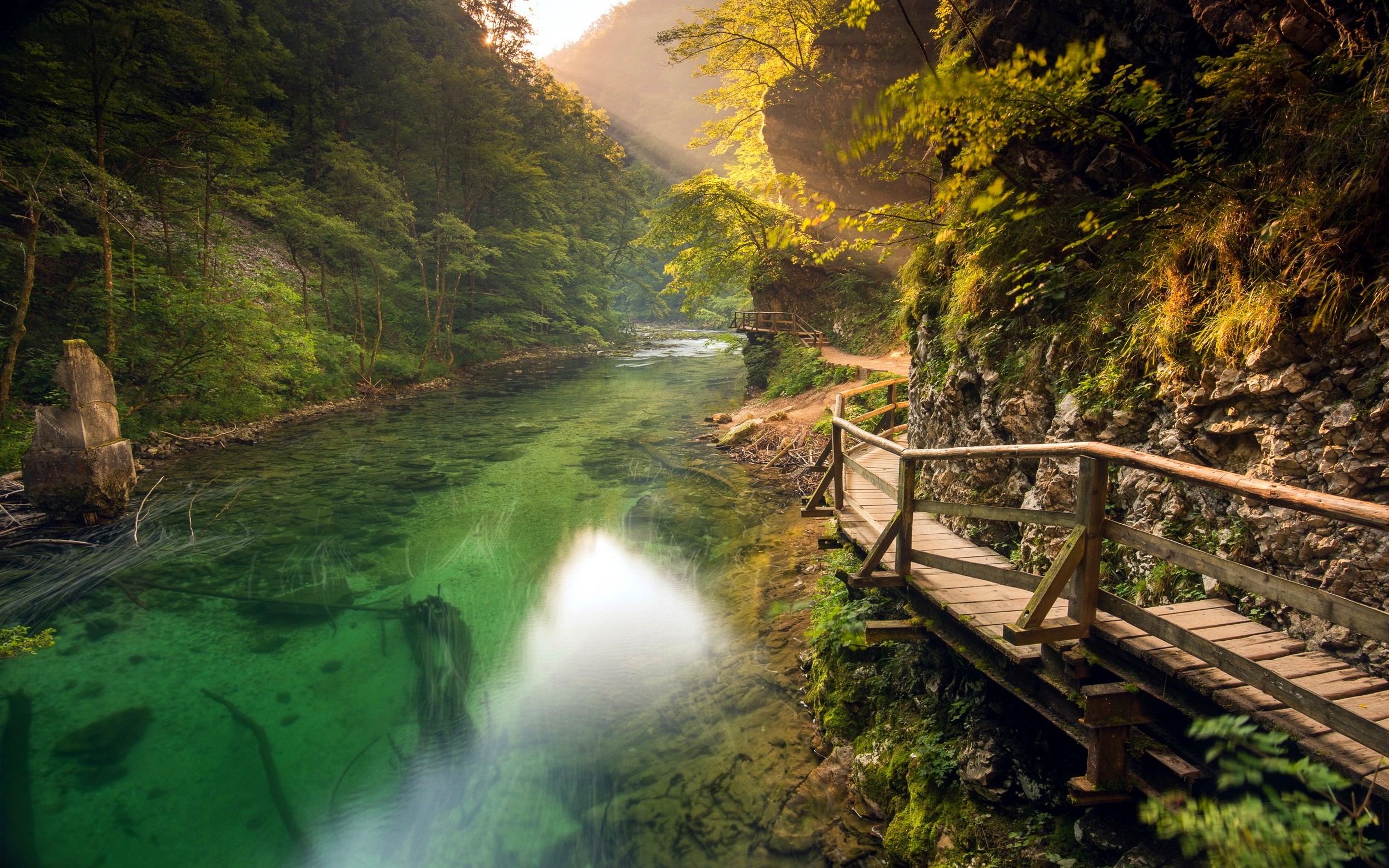 Wooden walkway along a turquoise river in Slovenia HD Wallpaper
