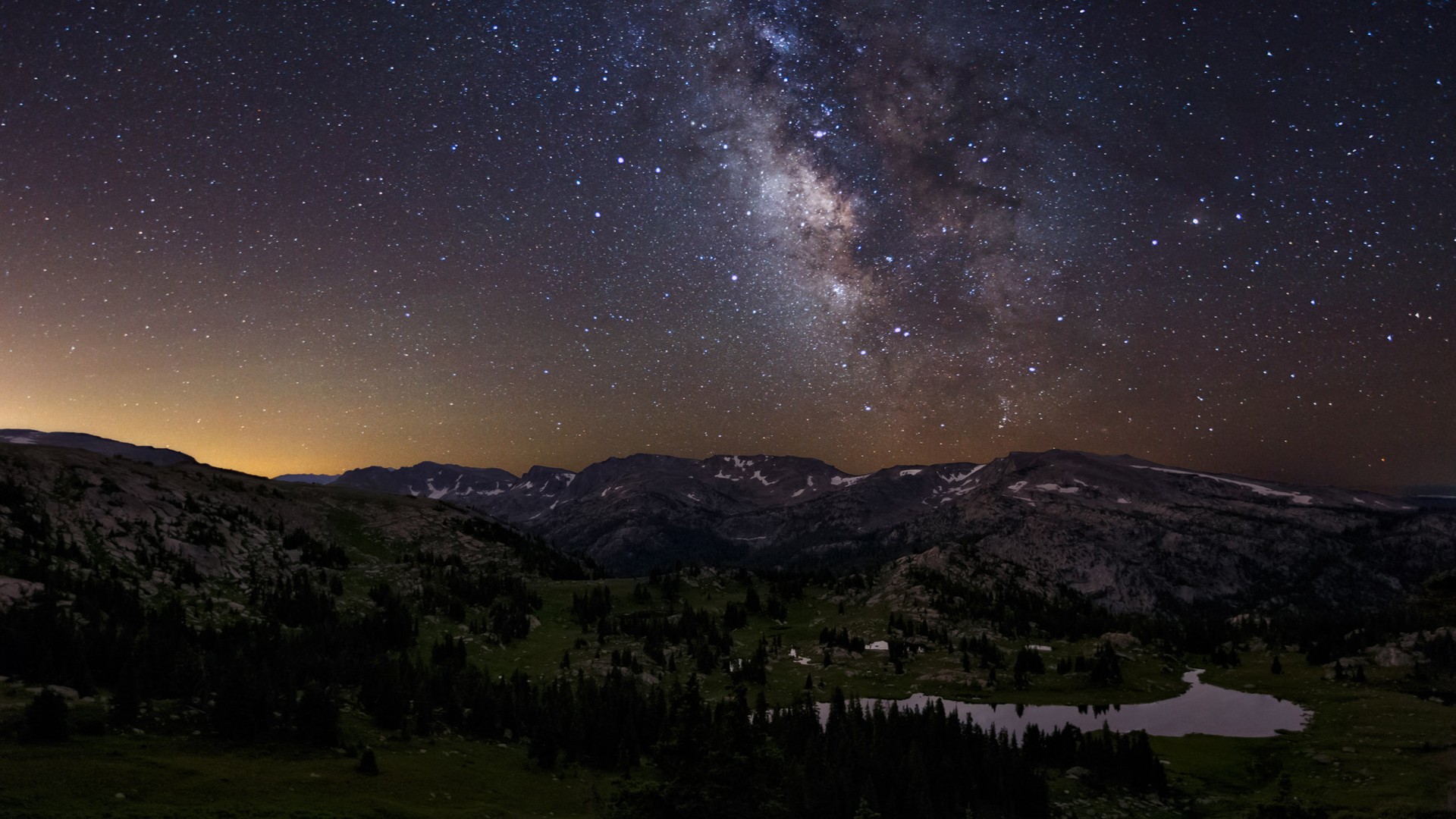 Milky Way over mountains and lake at night HD Wallpaper