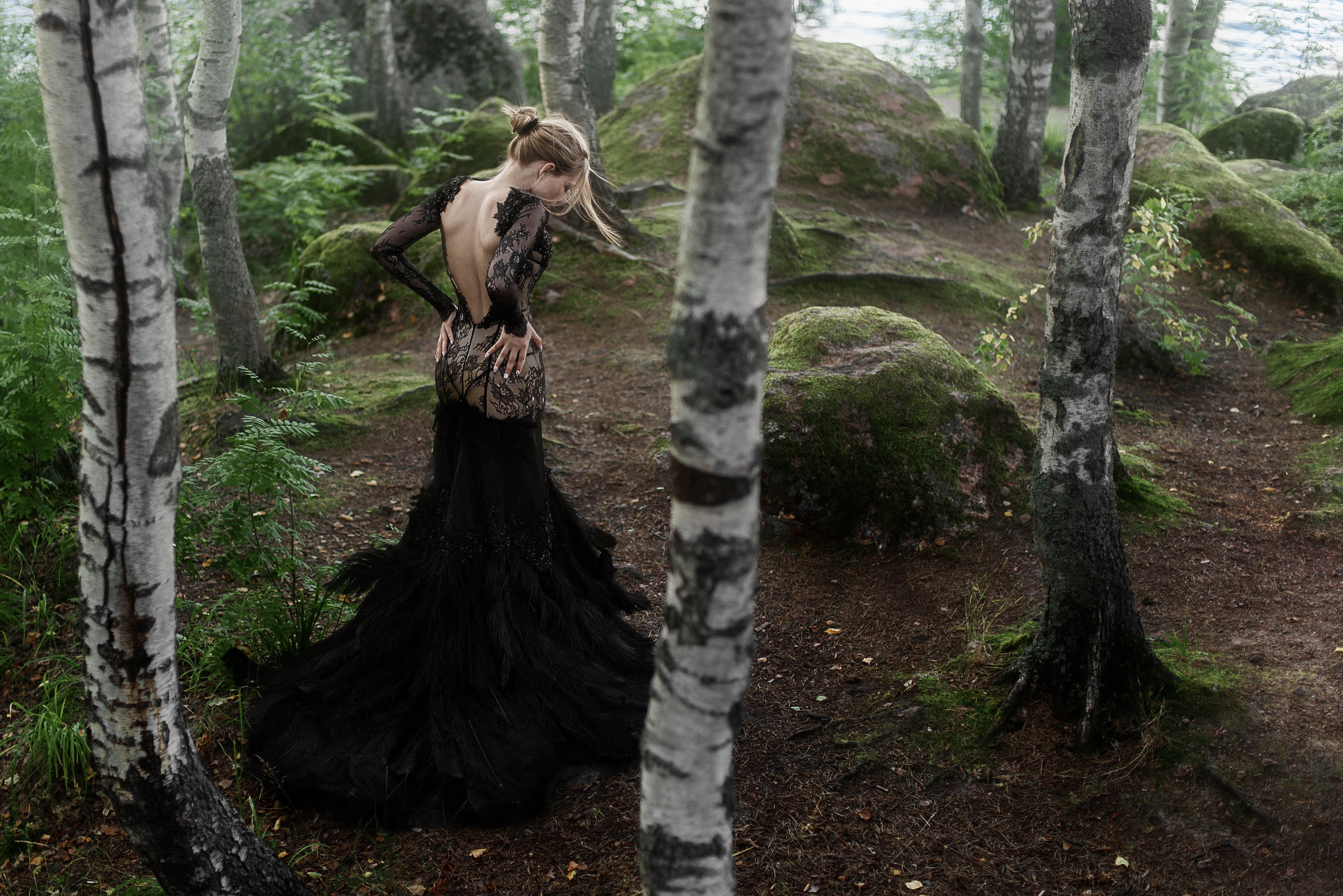 Woman in a black dress in a forest HD Wallpaper