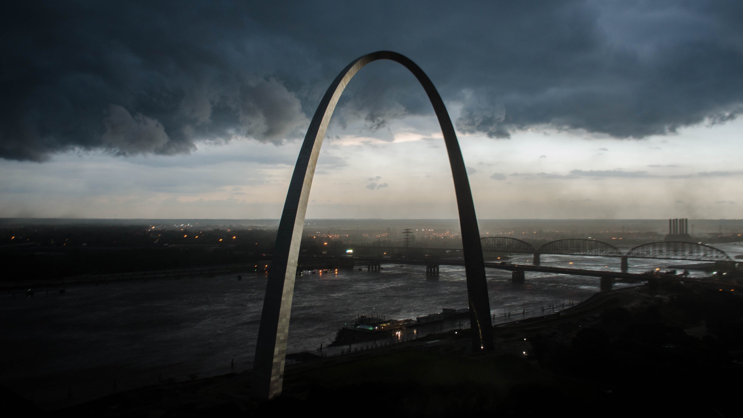 Gateway Arch National Park under stormy skies HD Wallpaper