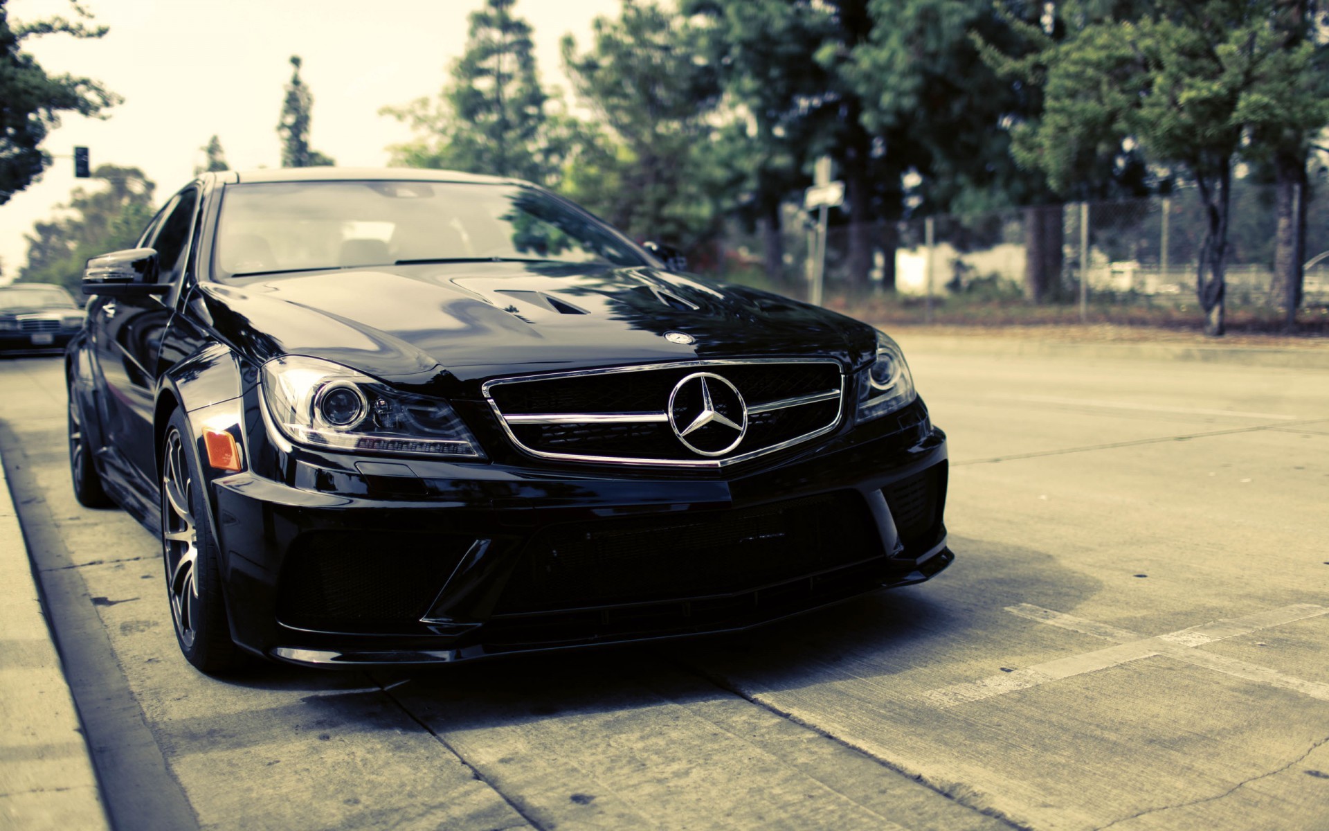 Black Mercedes-Benz C-Class parked on a street HD Wallpaper