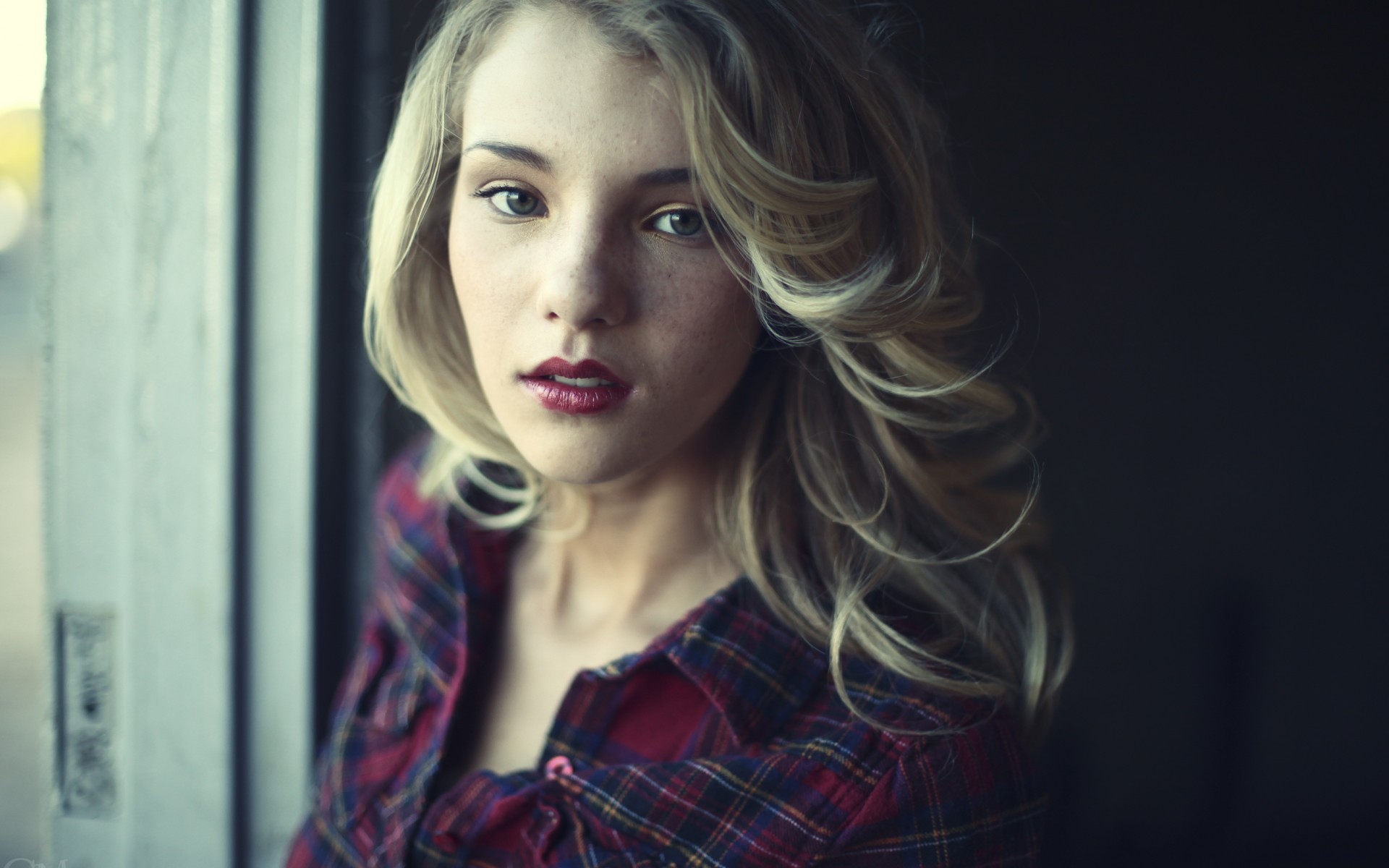 Portrait of a blonde woman with freckles wearing a plaid shirt HD Wallpaper