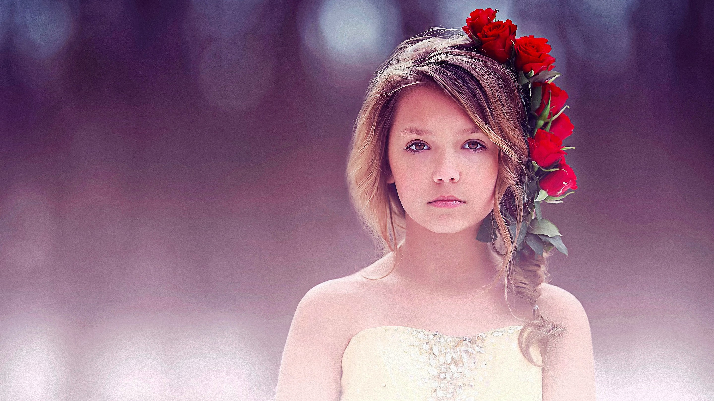 Young girl with red roses in her hair HD Wallpaper