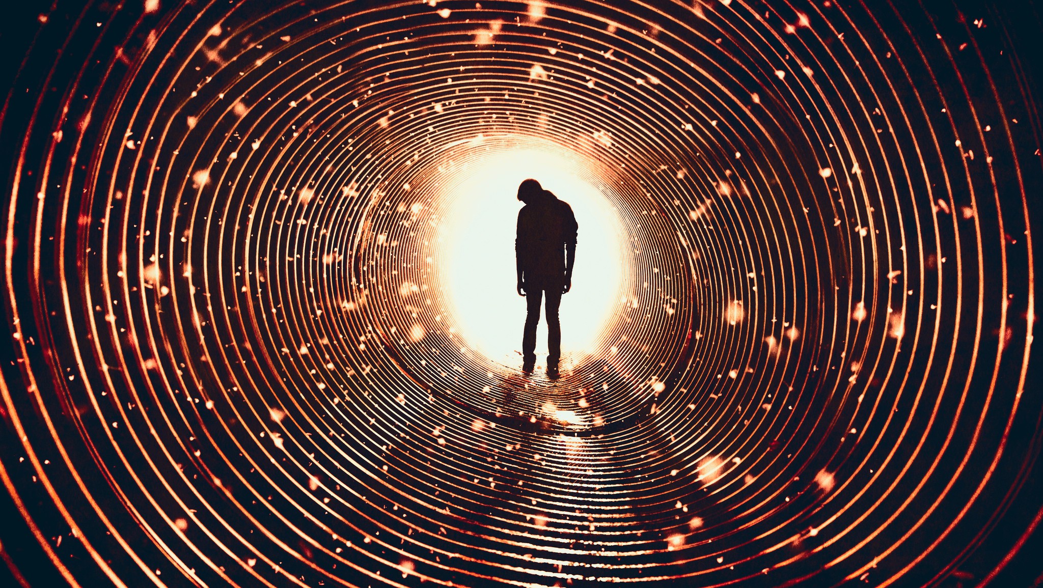 Silhouette of a man in a glowing tunnel HD Wallpaper