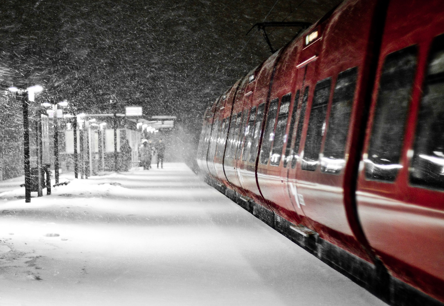 Red train at a snowy station at night HD Wallpaper