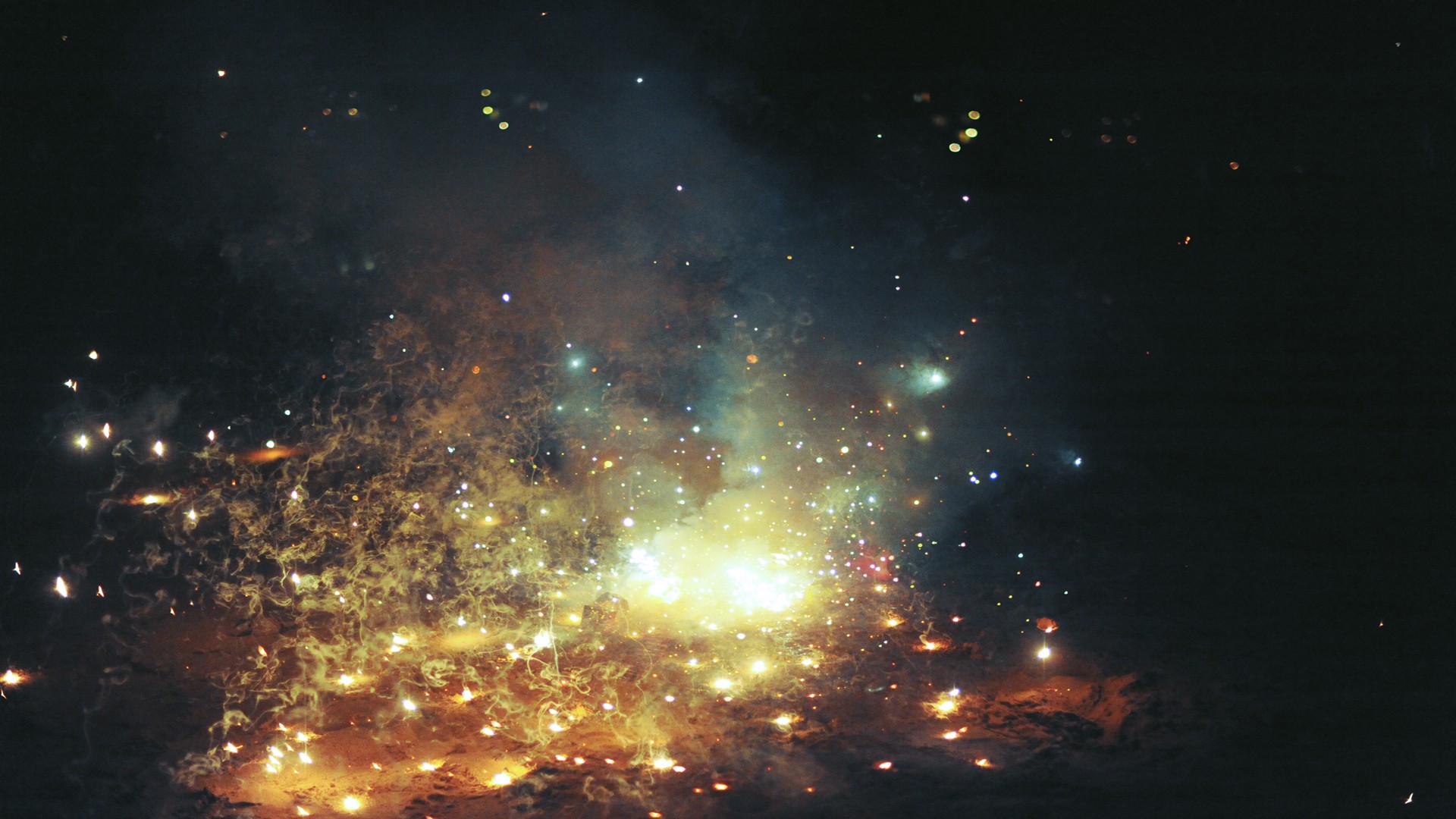 Fireworks exploding in the night sky HD Wallpaper