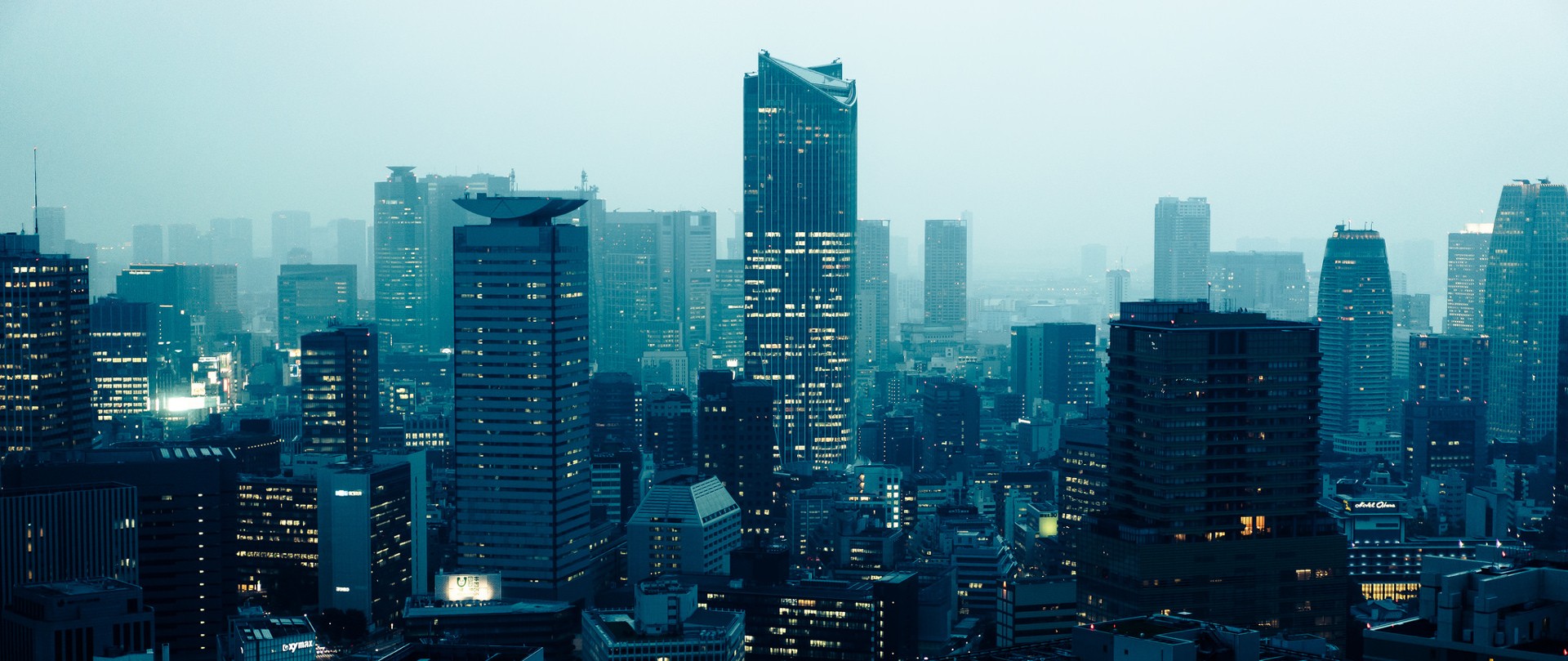Tokyo cityscape at dusk with illuminated skyscrapers HD Wallpaper
