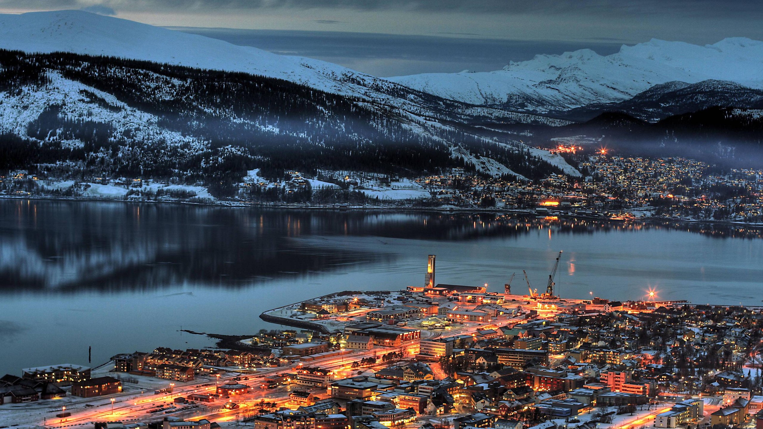 Town and harbor at the foot of snow-covered mountains in Norway HD Wallpaper