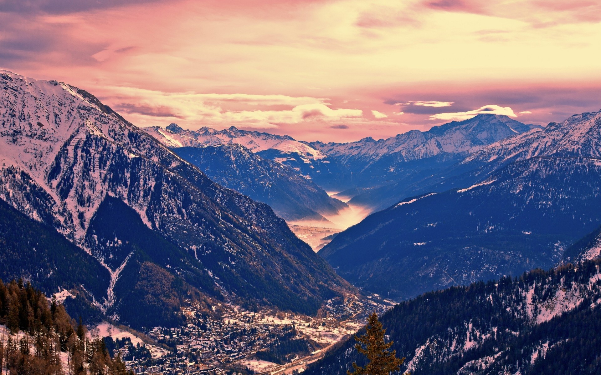 Snow-capped mountains and valley at sunset HD Wallpaper