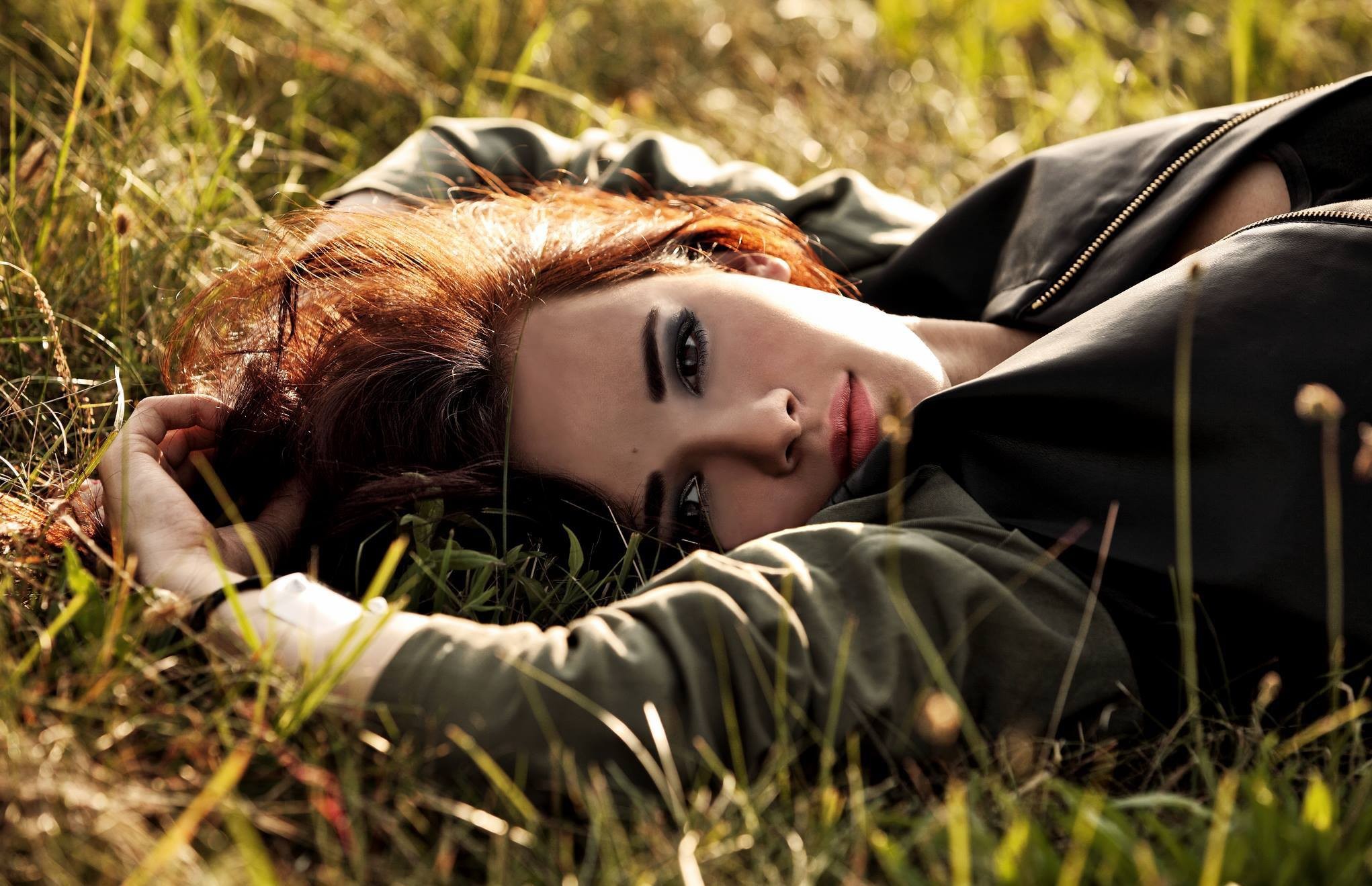 Natalia Szroeder lying in grass HD Wallpaper