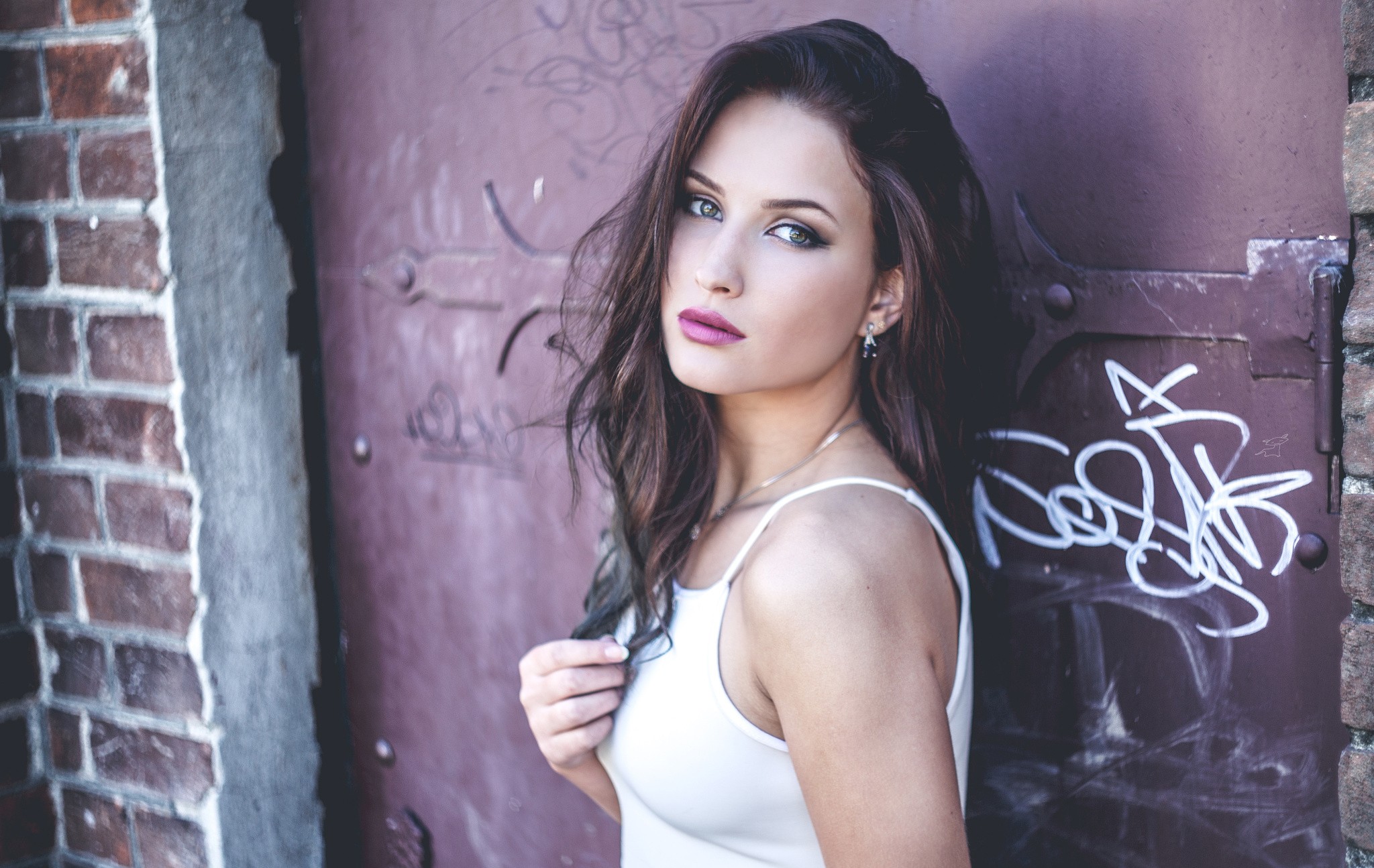 Brunette woman with hazel eyes in white top HD Wallpaper