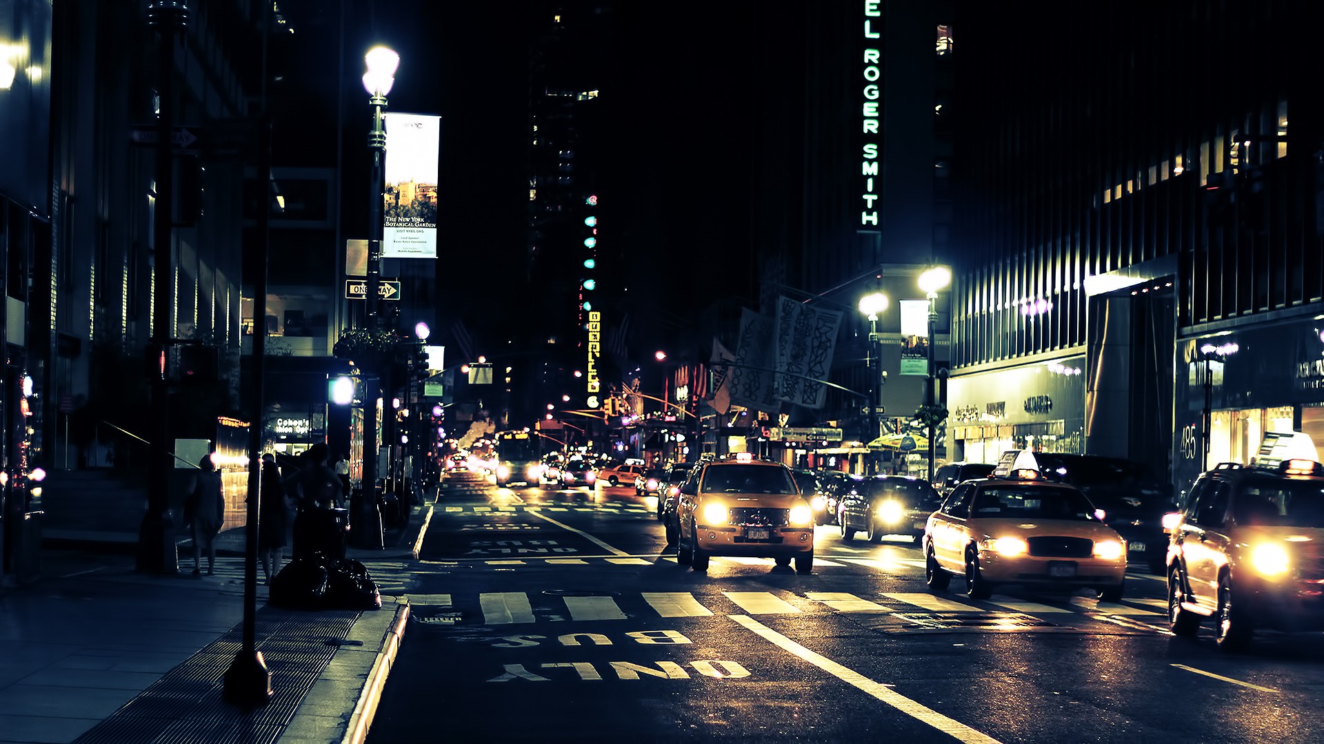 New York City street at night with taxis HD Wallpaper
