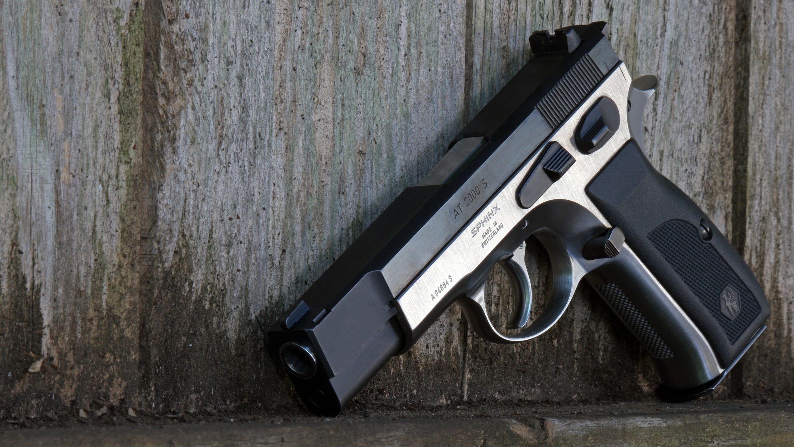 Sphinx AT2000S pistol on a wooden background HD Wallpaper