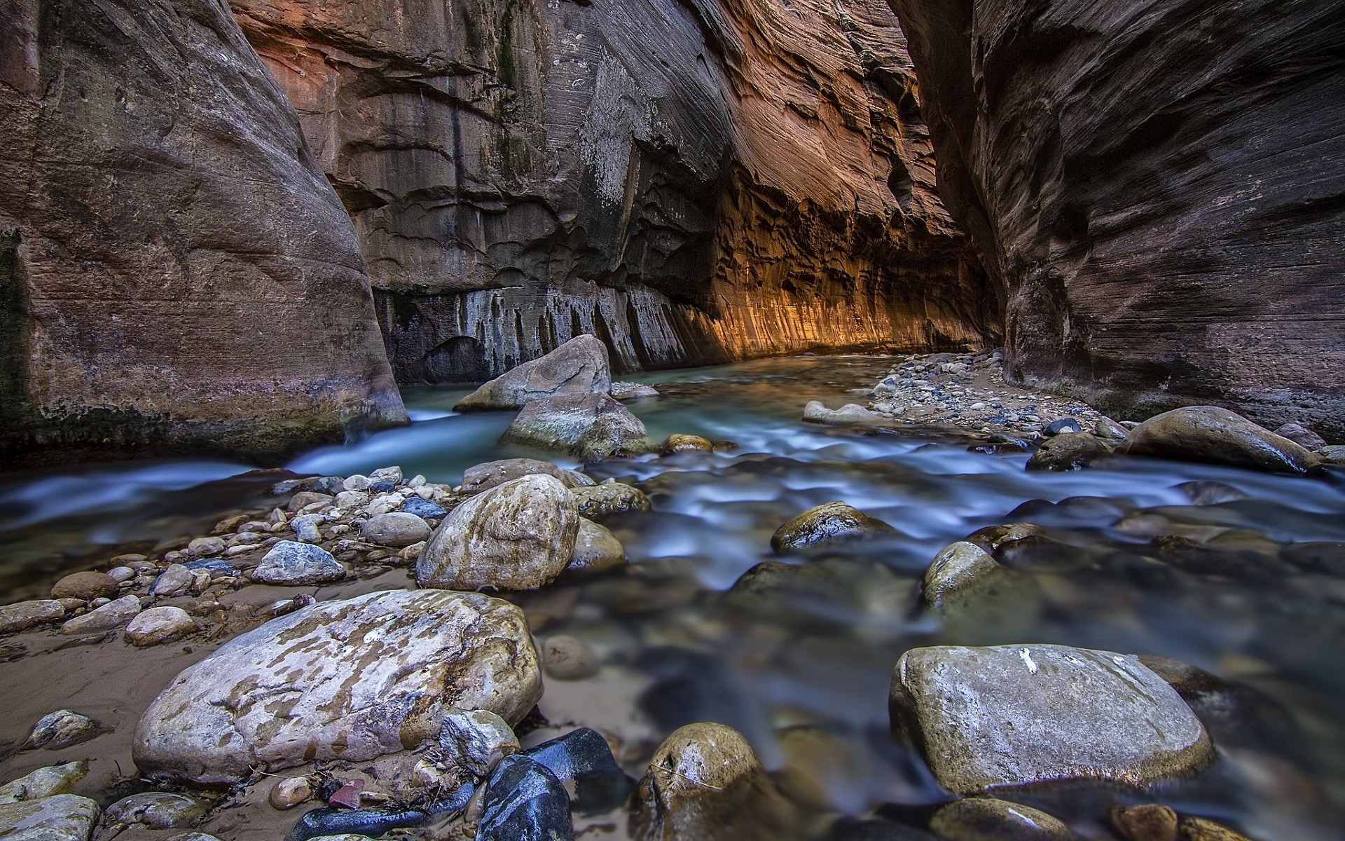 River flowing through a narrow canyon with rock walls HD Wallpaper