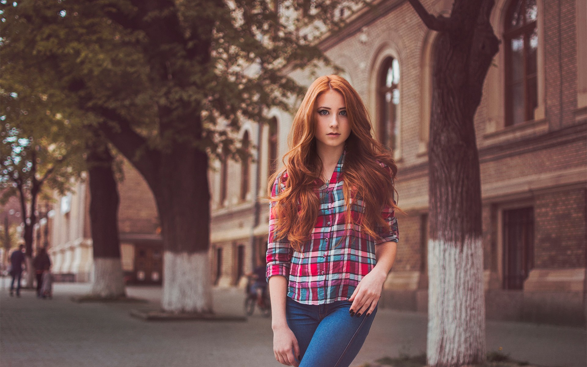 Redhead woman in plaid shirt and jeans on street HD Wallpaper