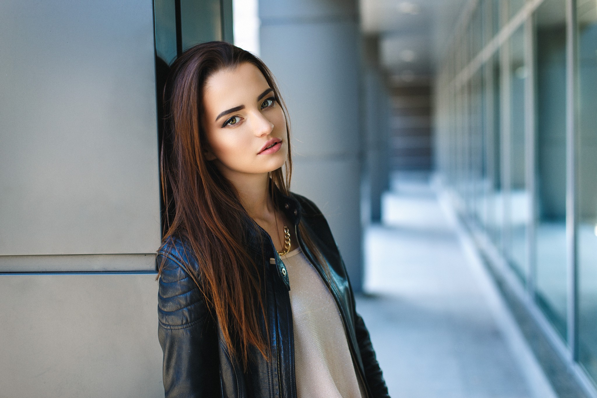 Portrait of a young woman in a leather jacket HD Wallpaper