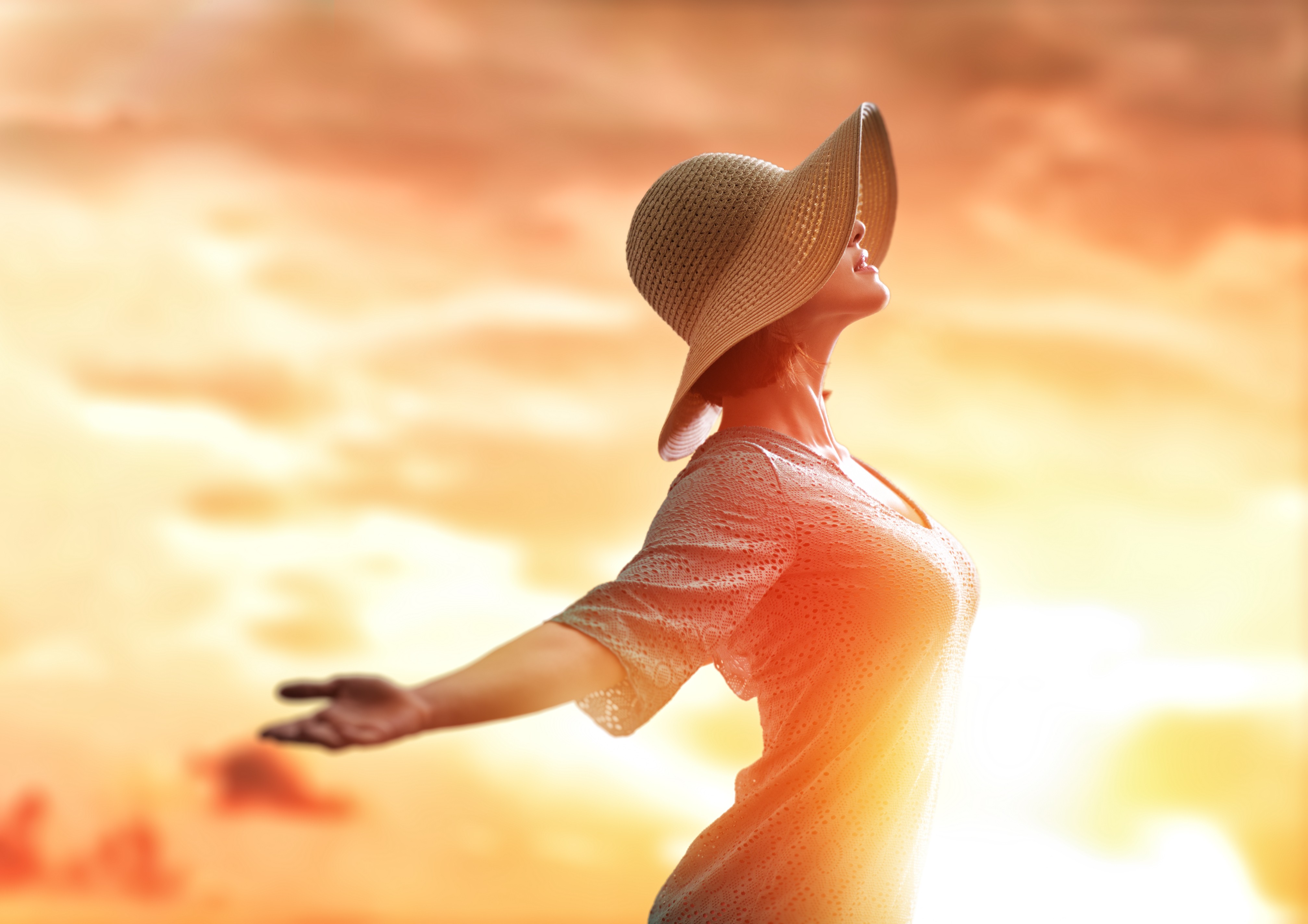 Woman in sun hat at sunset HD Wallpaper