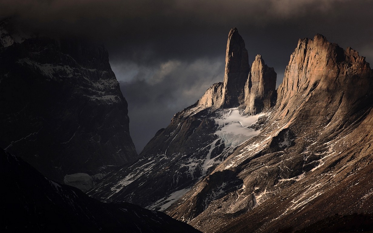 Torres del Paine mountains at sunset with snow and clouds HD Wallpaper