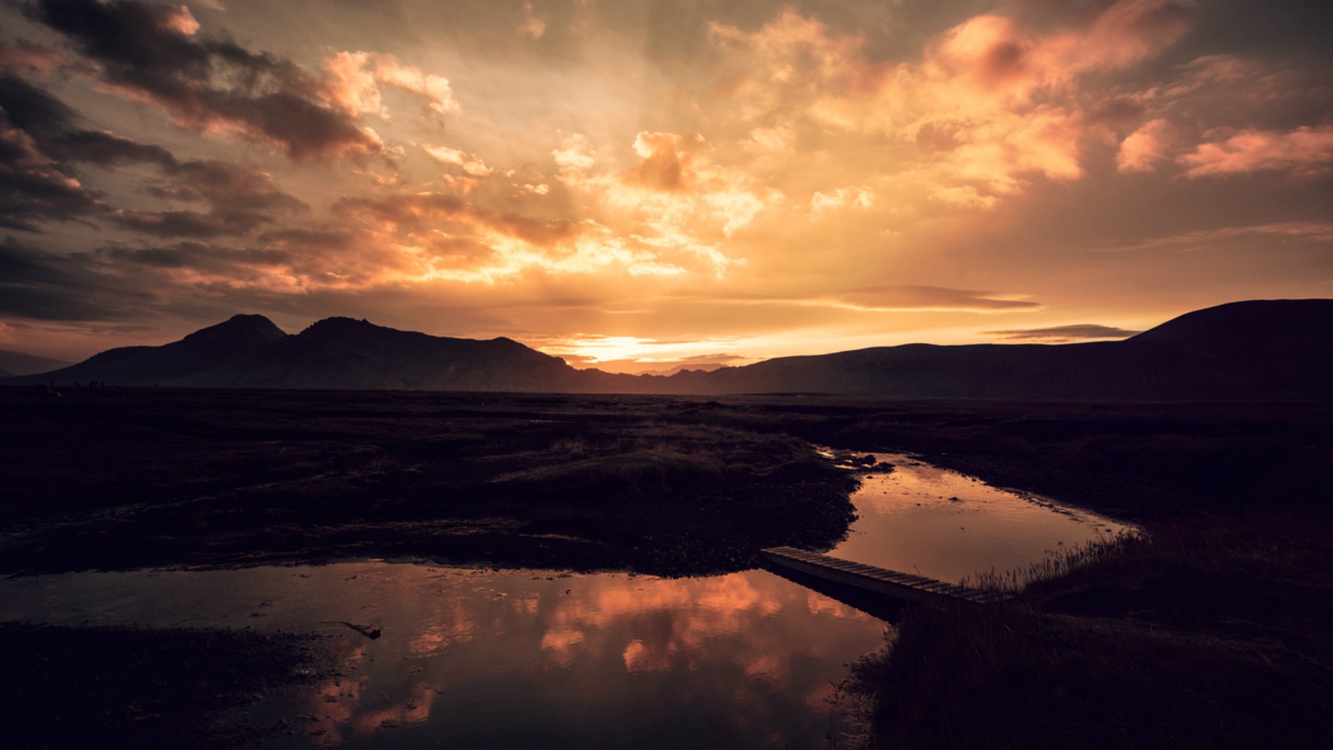 Sunset over mountains with river and bridge reflection HD Wallpaper