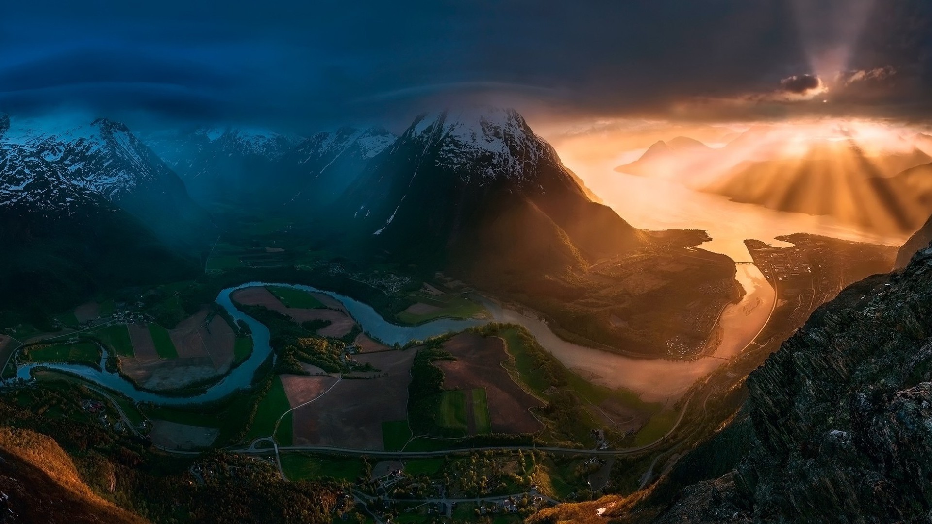 Mountains at sunset with a river valley HD Wallpaper