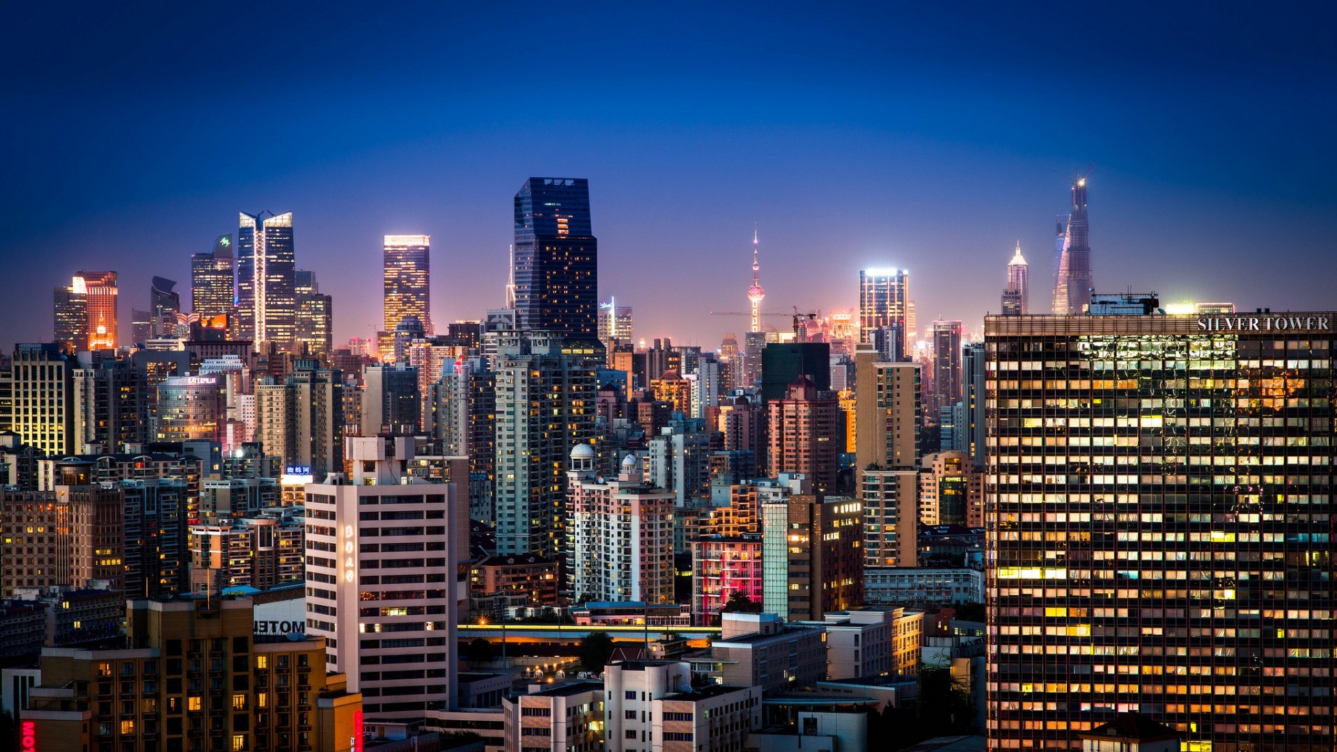Shanghai cityscape at night with illuminated skyscrapers HD Wallpaper