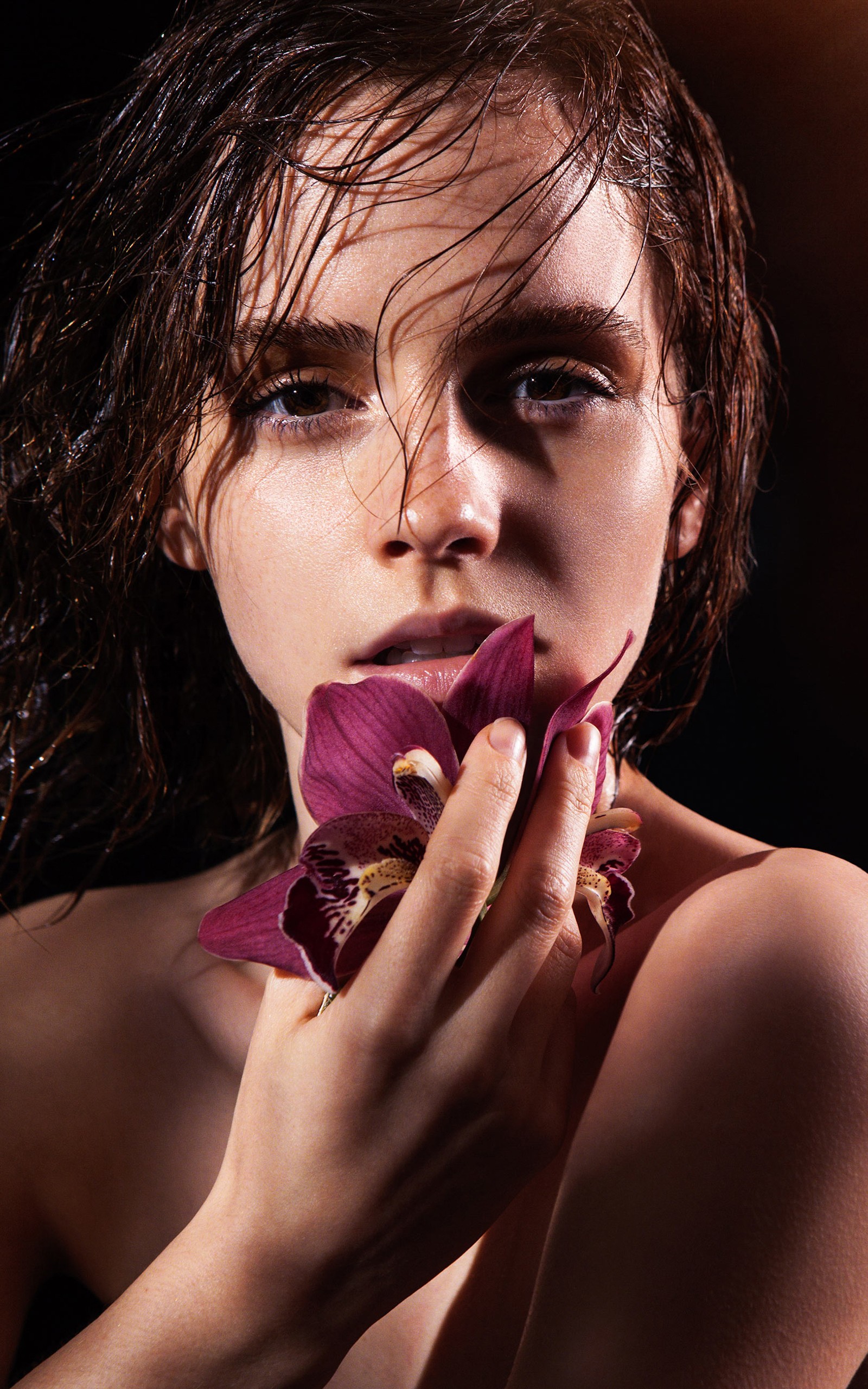 Emma Watson holding a purple orchid HD Wallpaper