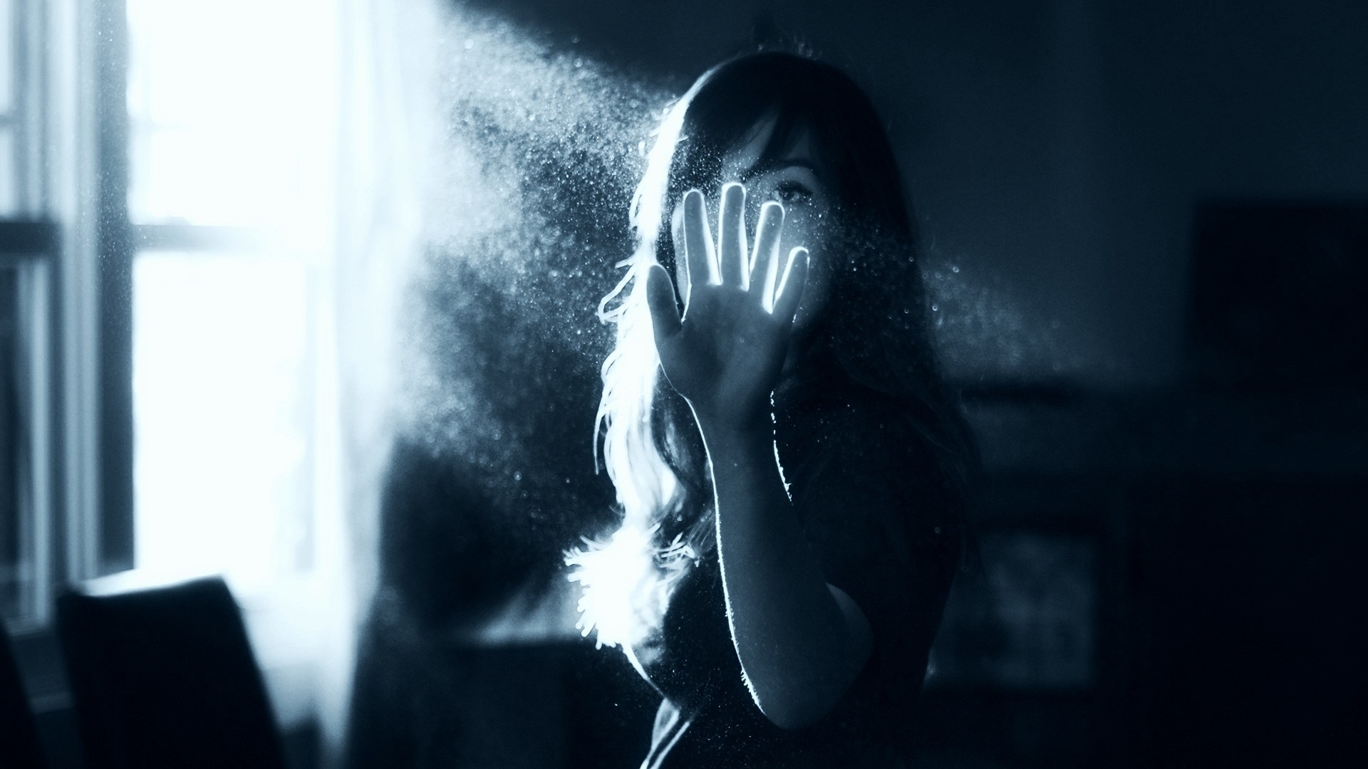 Woman with hand in front of face covered in dust HD Wallpaper