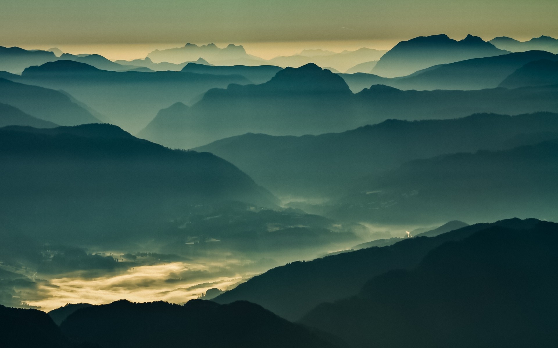 Misty mountain range landscape at sunrise HD Wallpaper