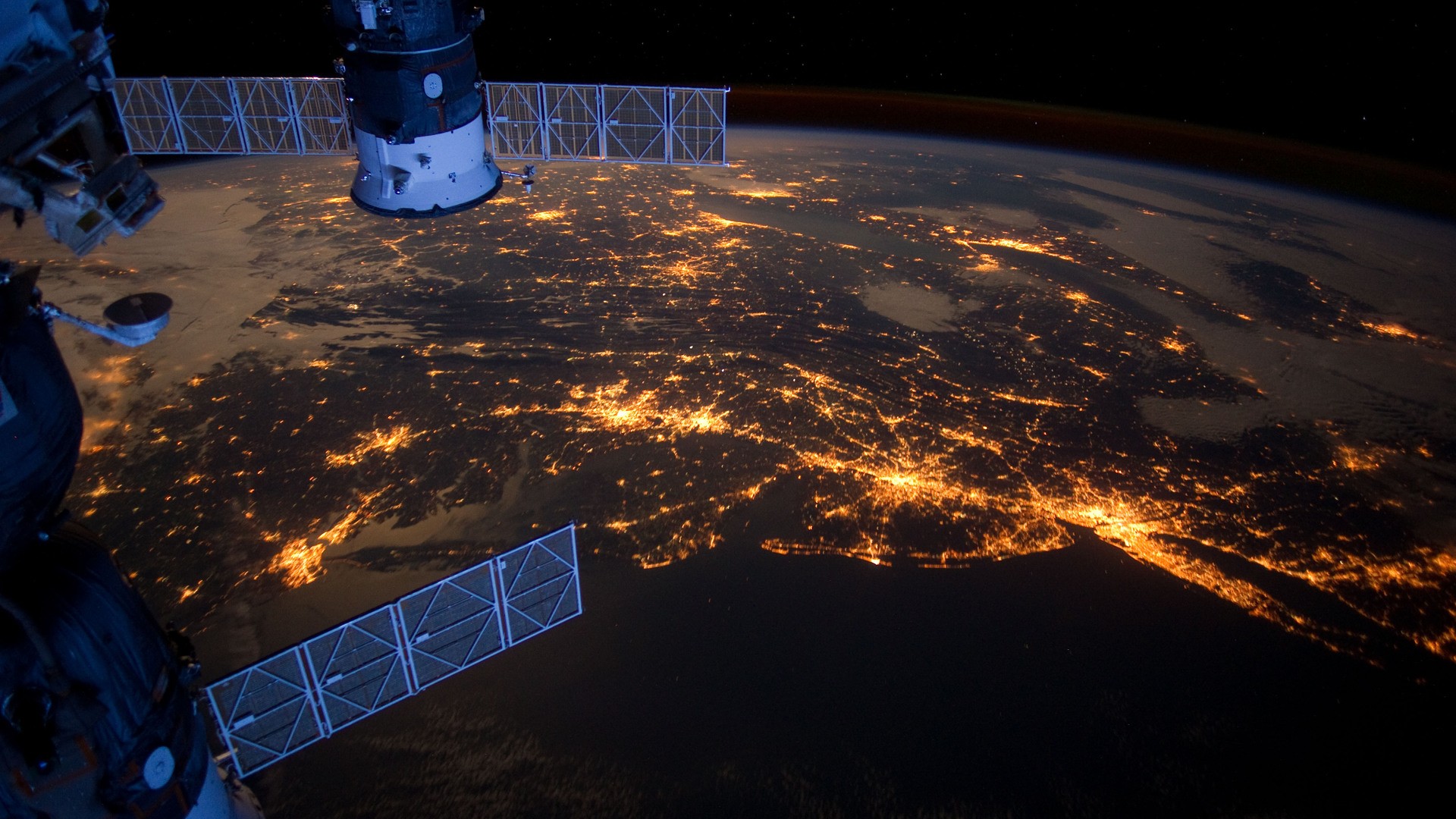Earth at night from space with ISS modules HD Wallpaper