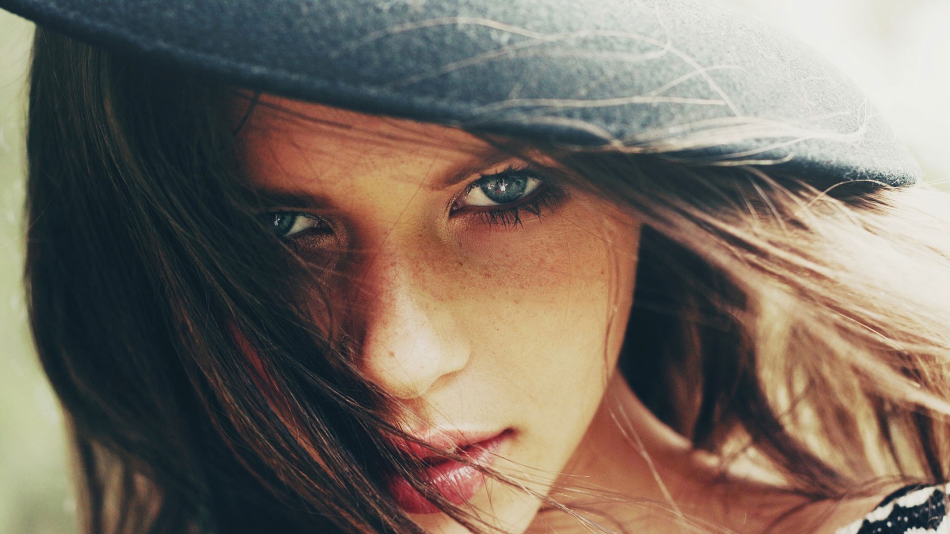 Close-up of a young woman with blue eyes and a hat HD Wallpaper