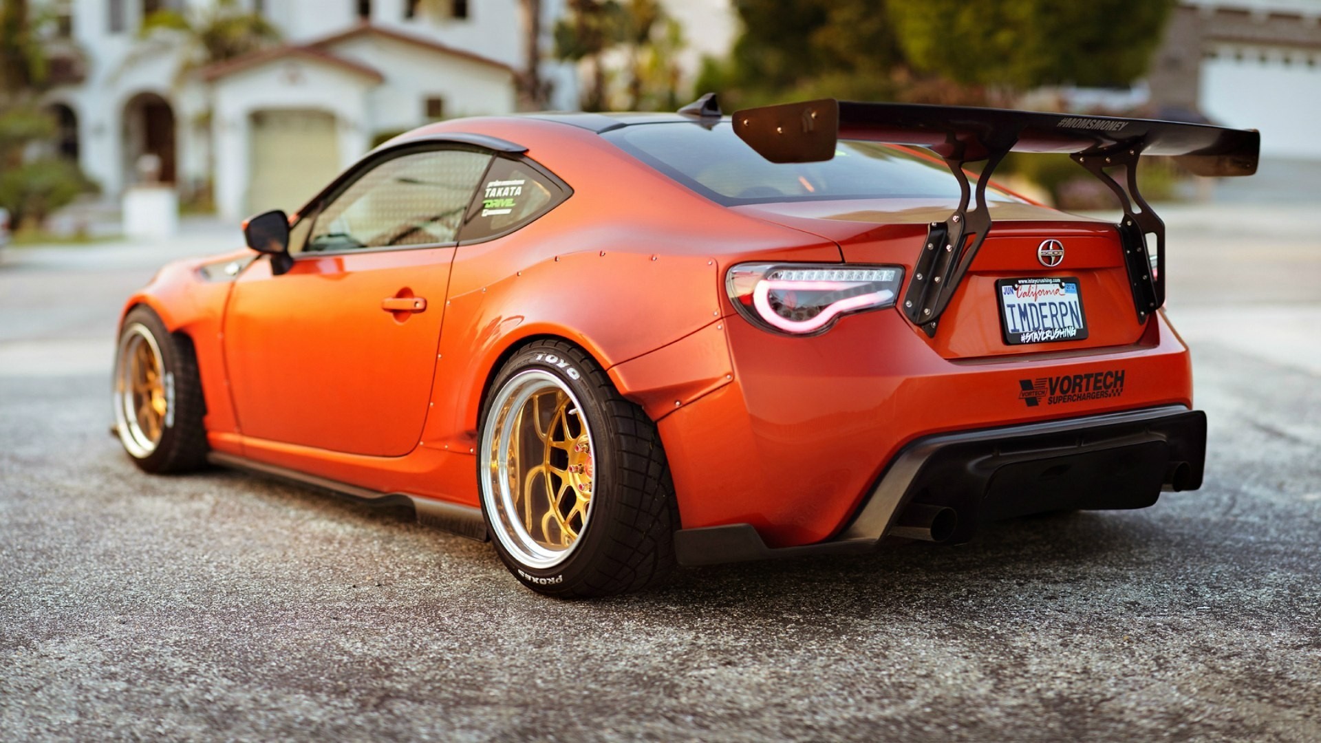 Orange Scion FR-S with a large rear spoiler HD Wallpaper
