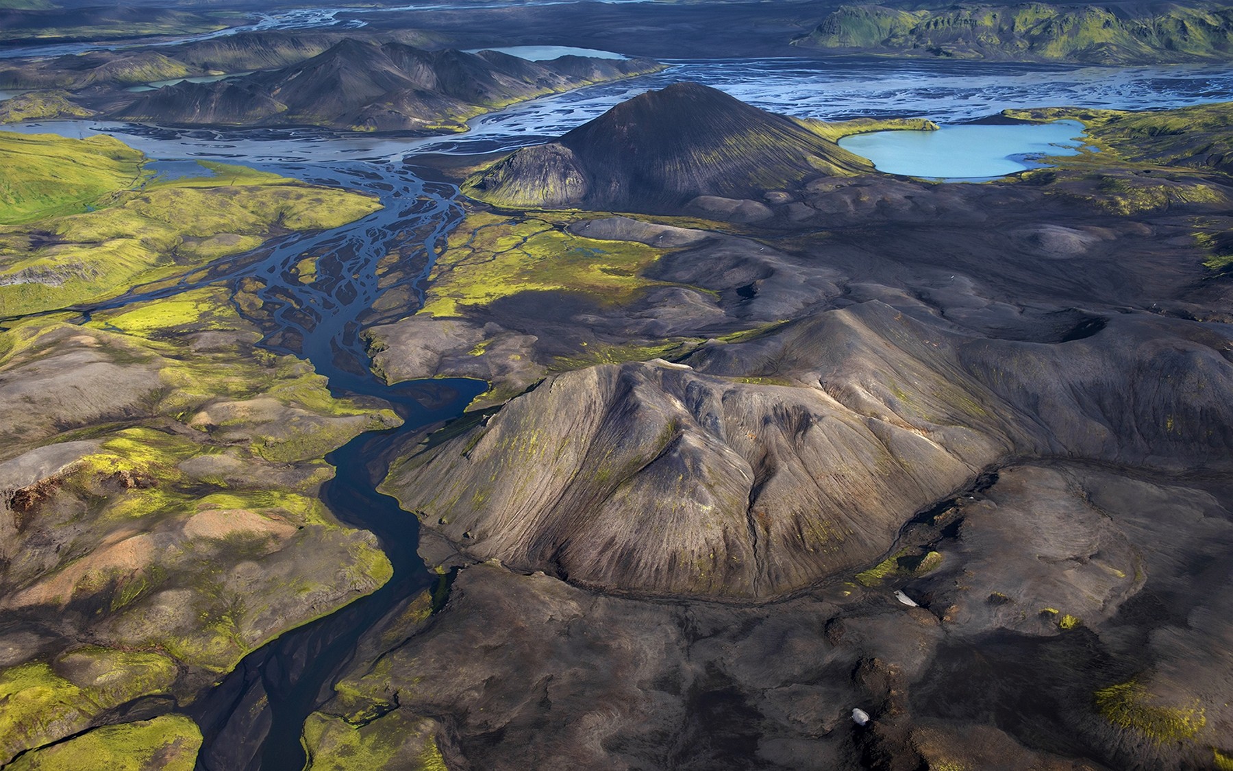 Aerial view of Iceland's volcanic landscape with rivers and lakes HD Wallpaper