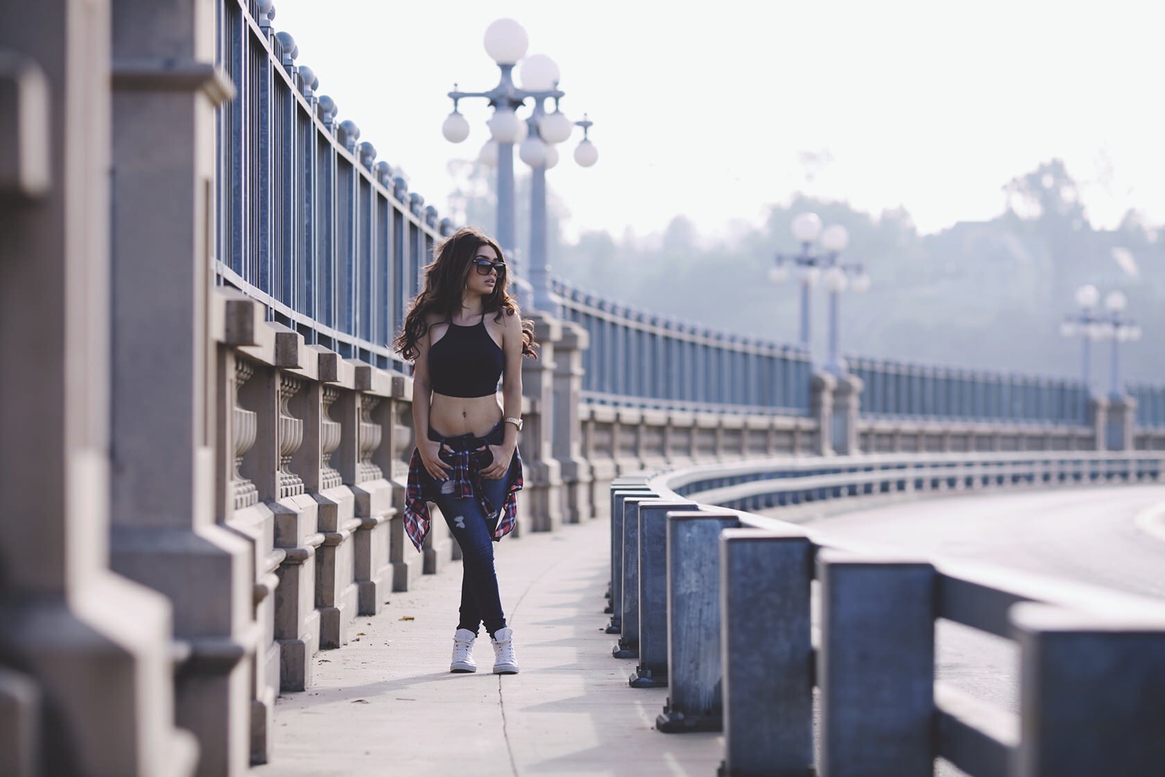 Woman in black top and jeans on a bridge HD Wallpaper