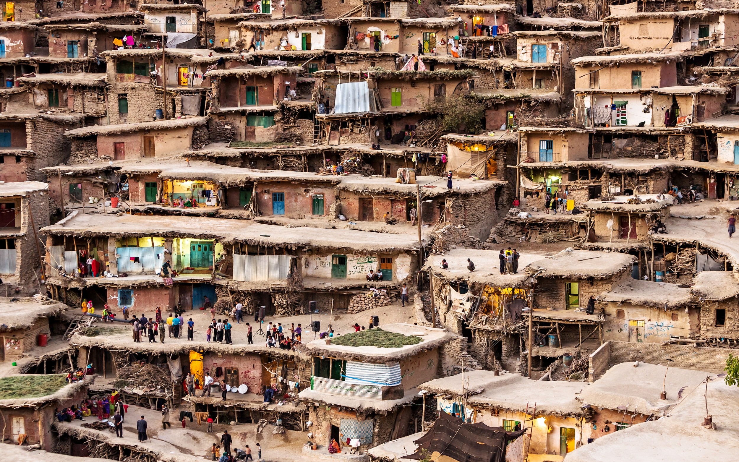 Terraced village houses in Iran with people HD Wallpaper