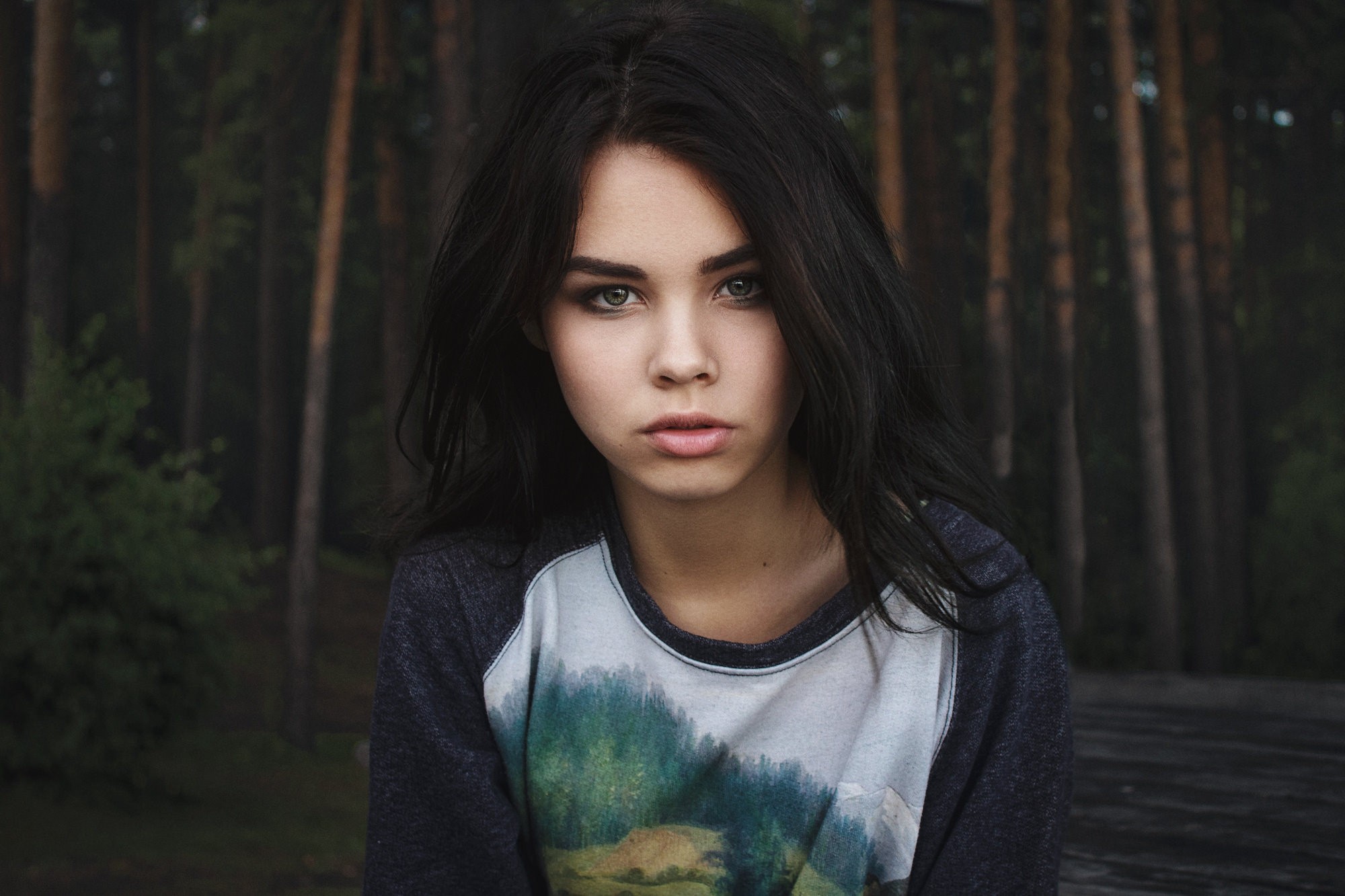 Portrait of a young woman in a forest HD Wallpaper