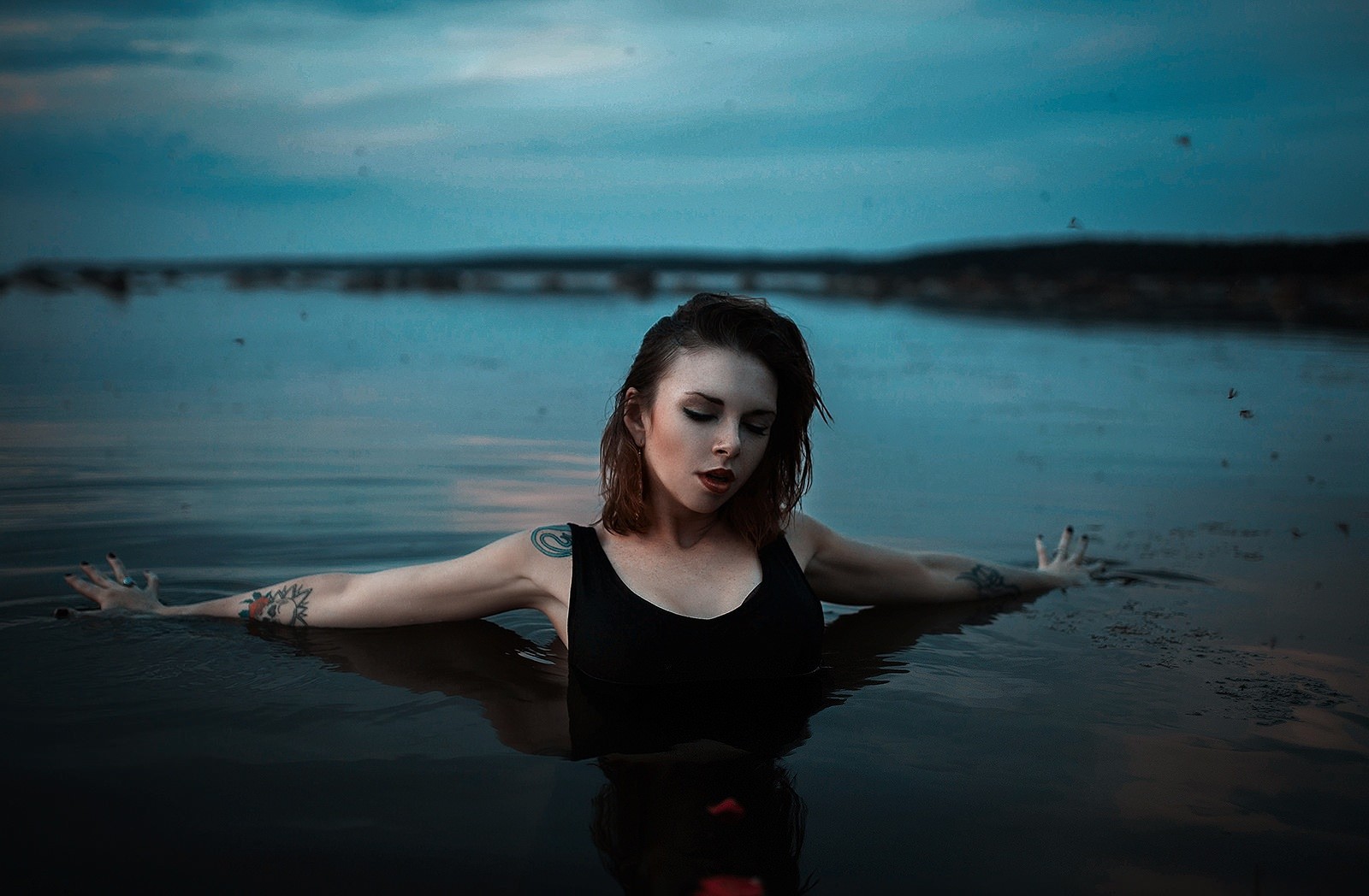 Woman with tattoos in a river HD Wallpaper